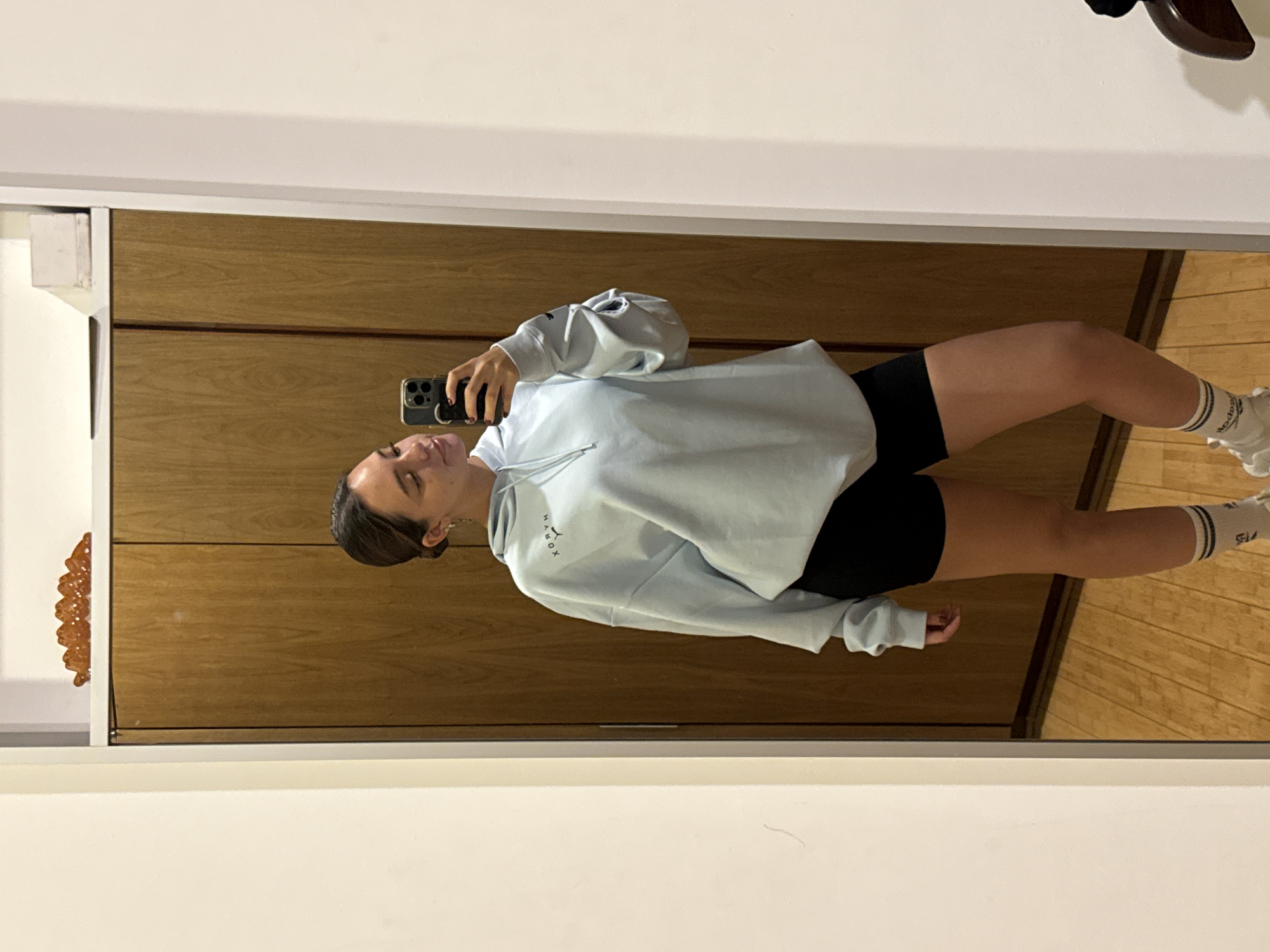 Woman takes late-night mirror selfie in Mexican home