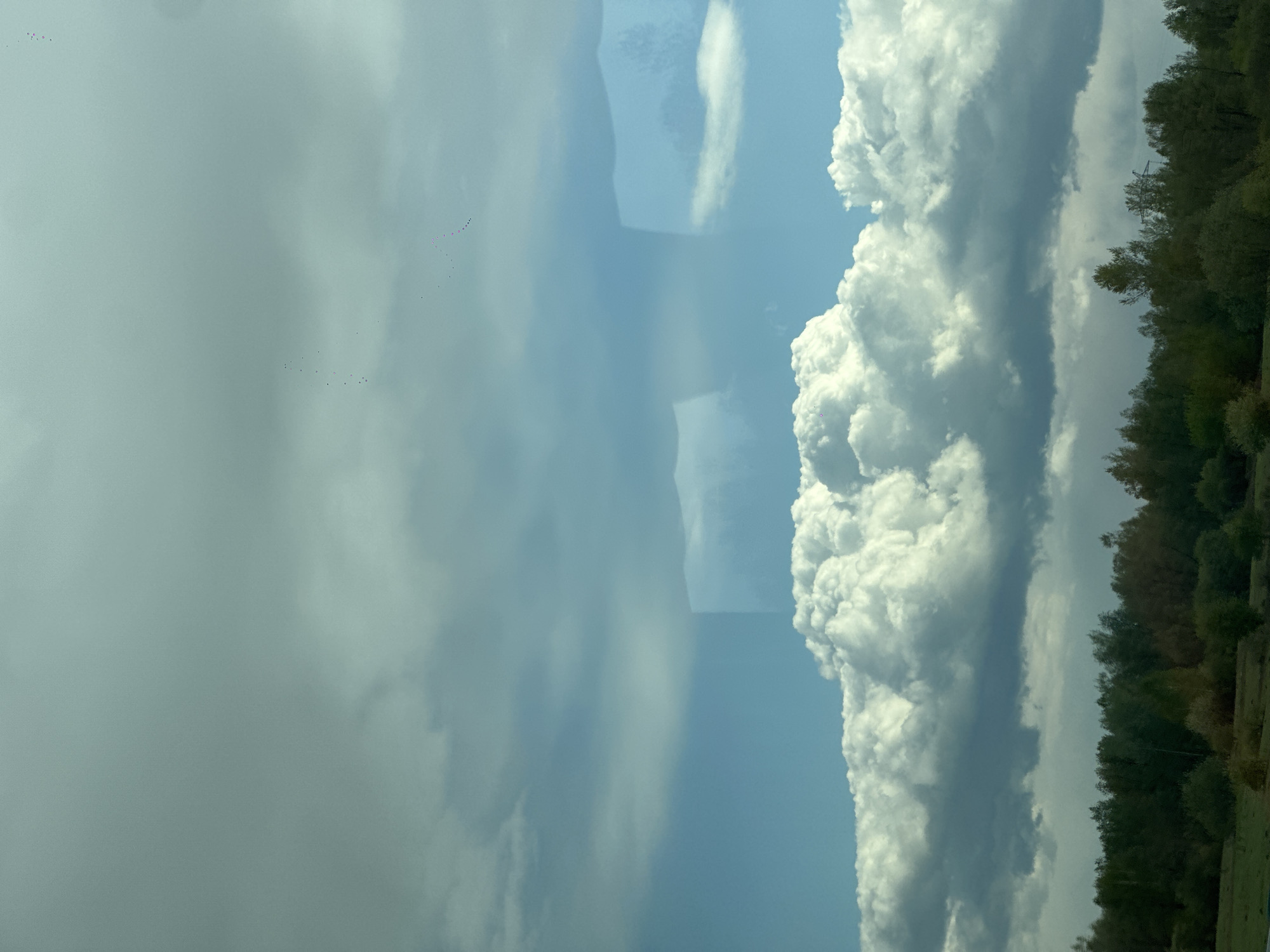 Cumulus clouds observed over rural Russia landscape