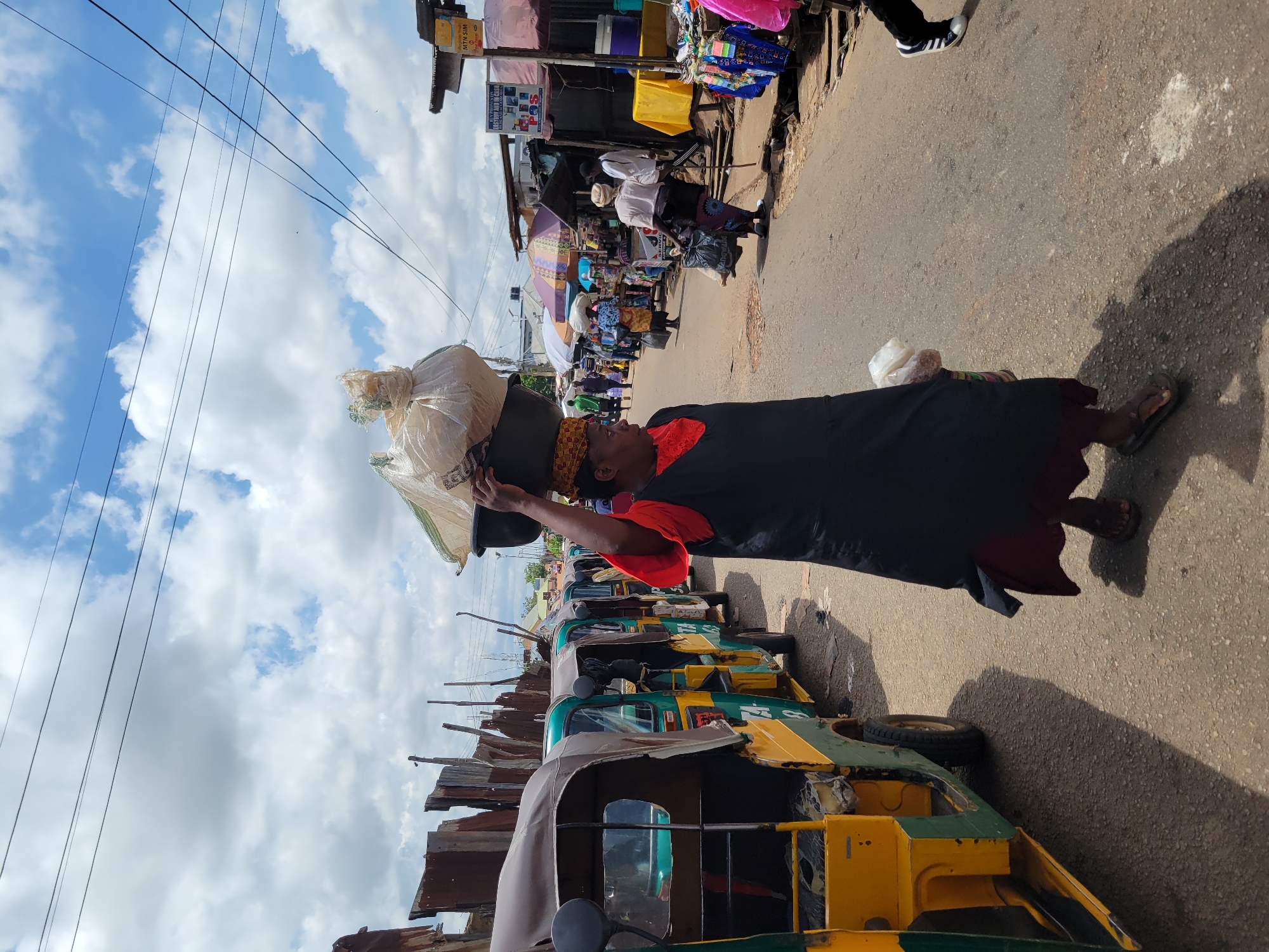 Street life and market activity across Jos on a cloudy morning