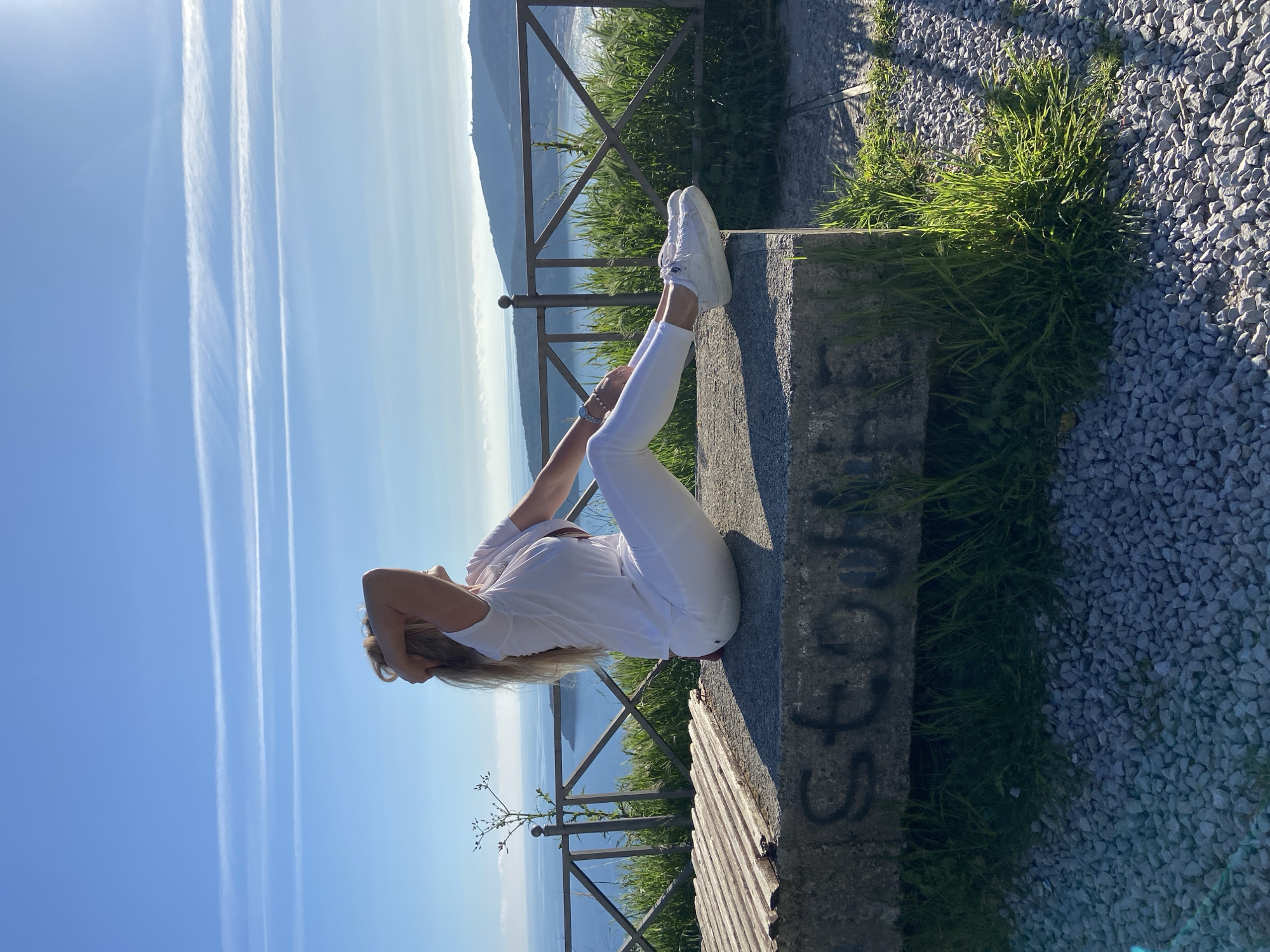 Woman photographs afternoon outing at Montenegro scenic overlook