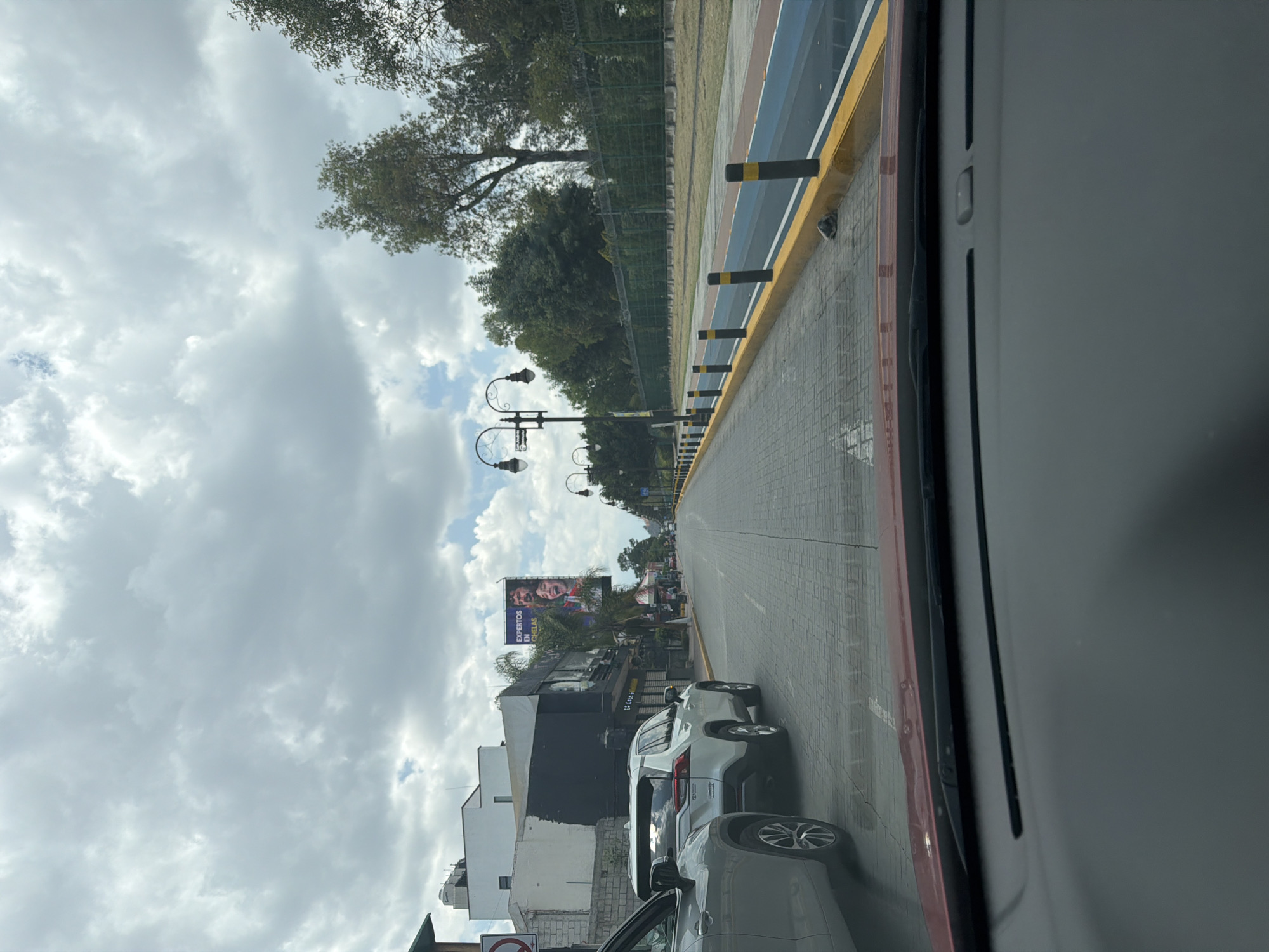 Evening scenes captured in San Andrés Cholula show traffic, dining