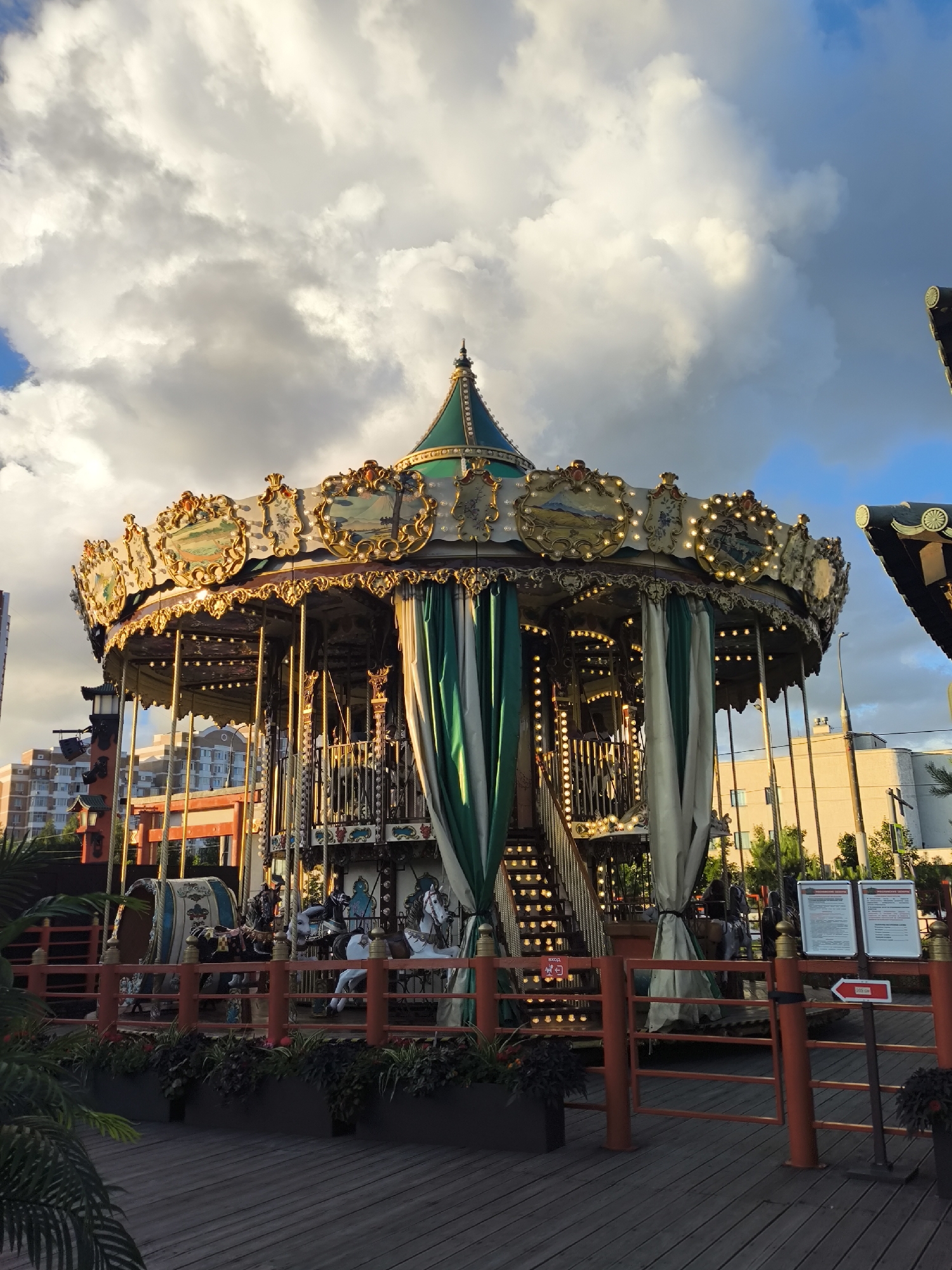 Japanese-themed cultural space with carousel, sculptures, and skatepark
