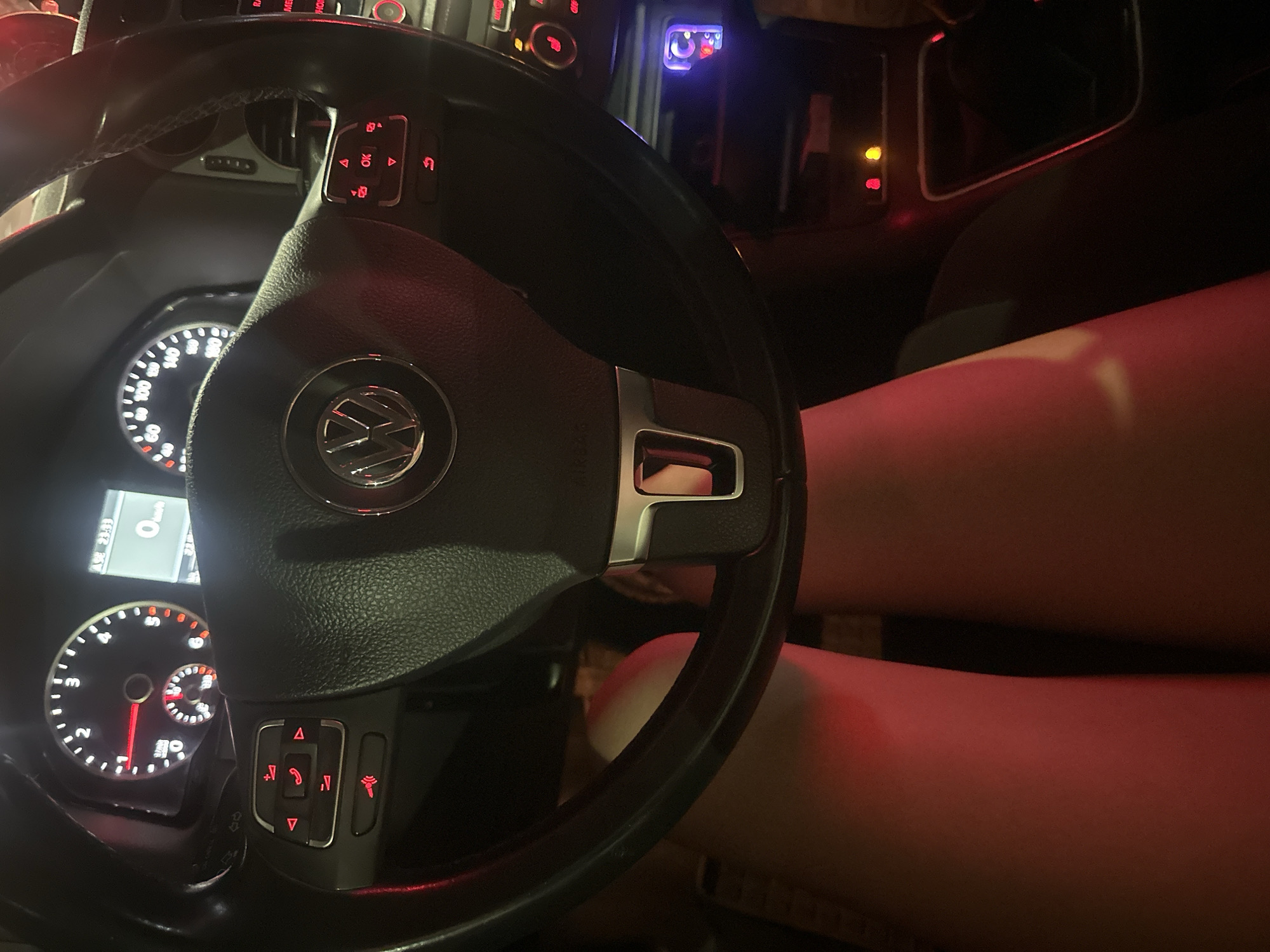 Driver sits in stationary car during rainy night in Sofia