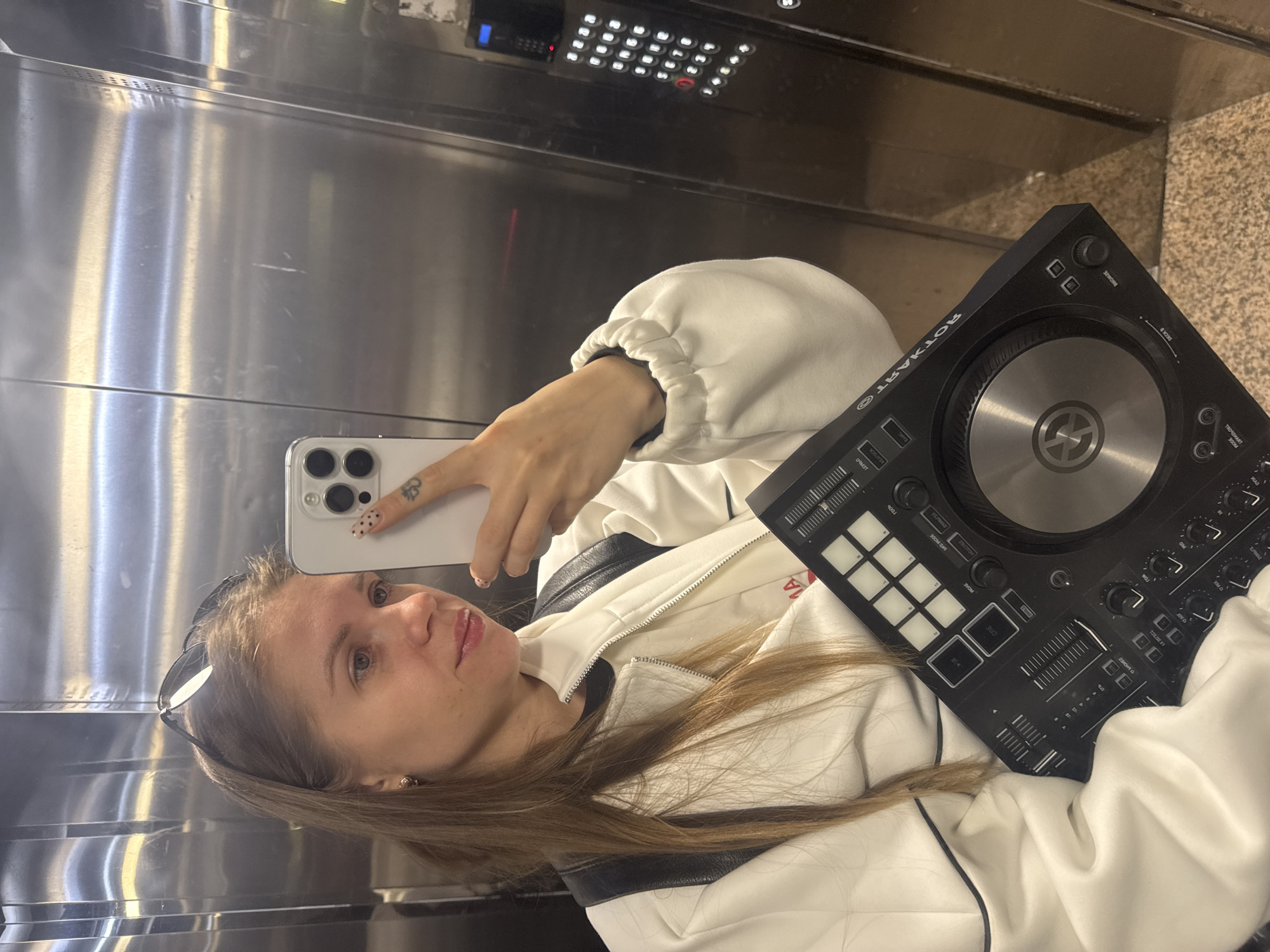 Woman takes elevator selfie in Batumi, Georgia