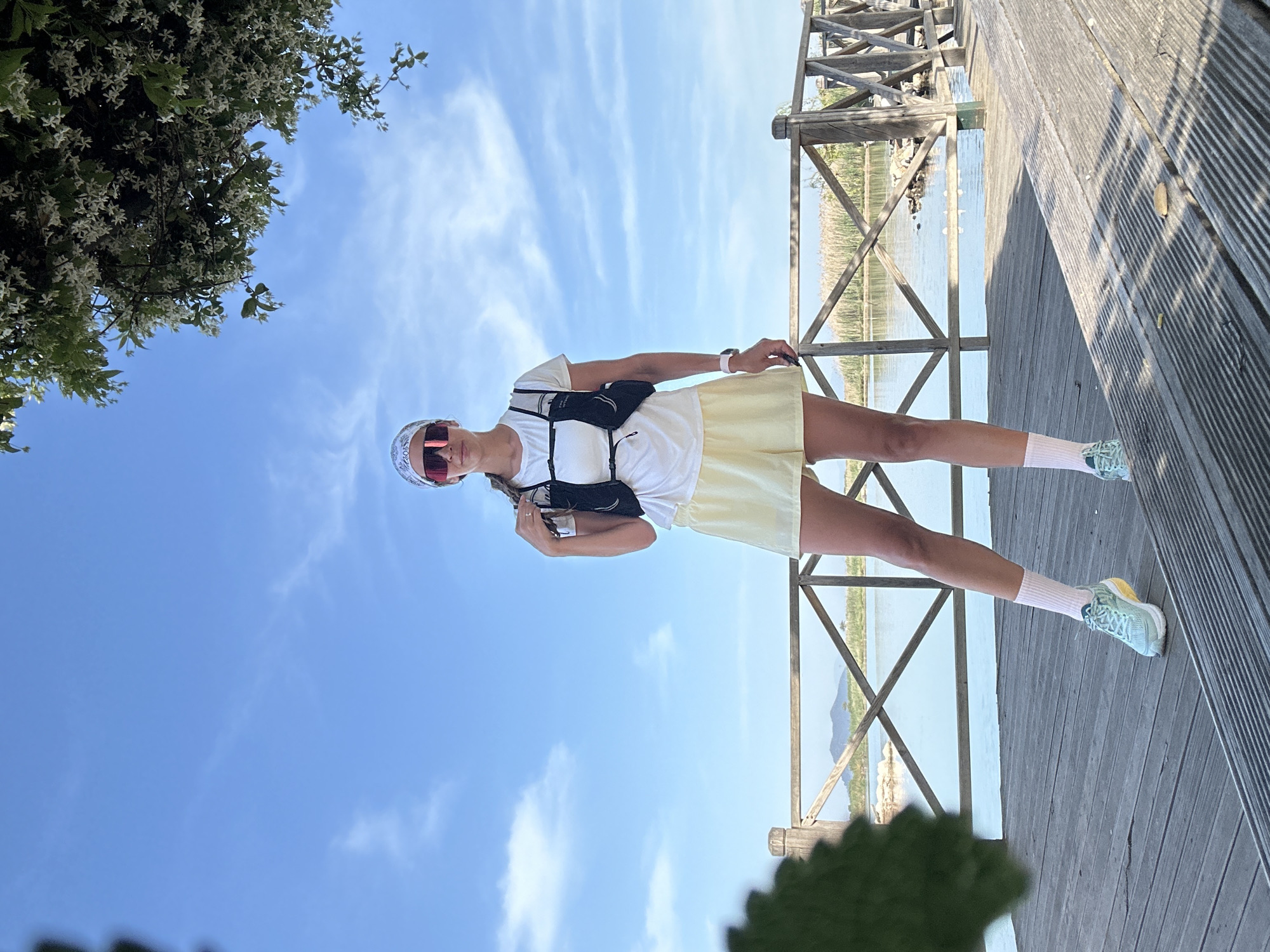 Woman photographs herself with geese at Fethiye lagoon boardwalk
