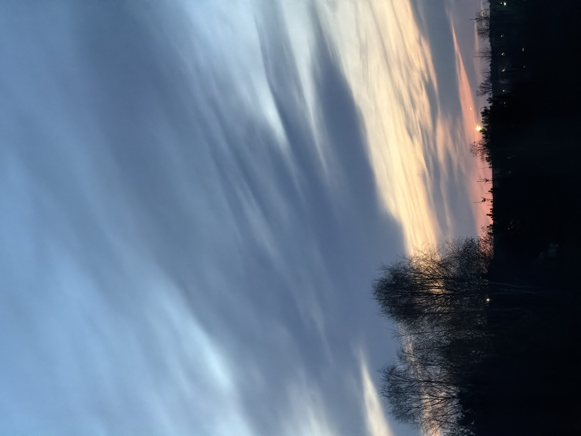 Evening sky displays colorful sunset over Dreiliņi, Latvia