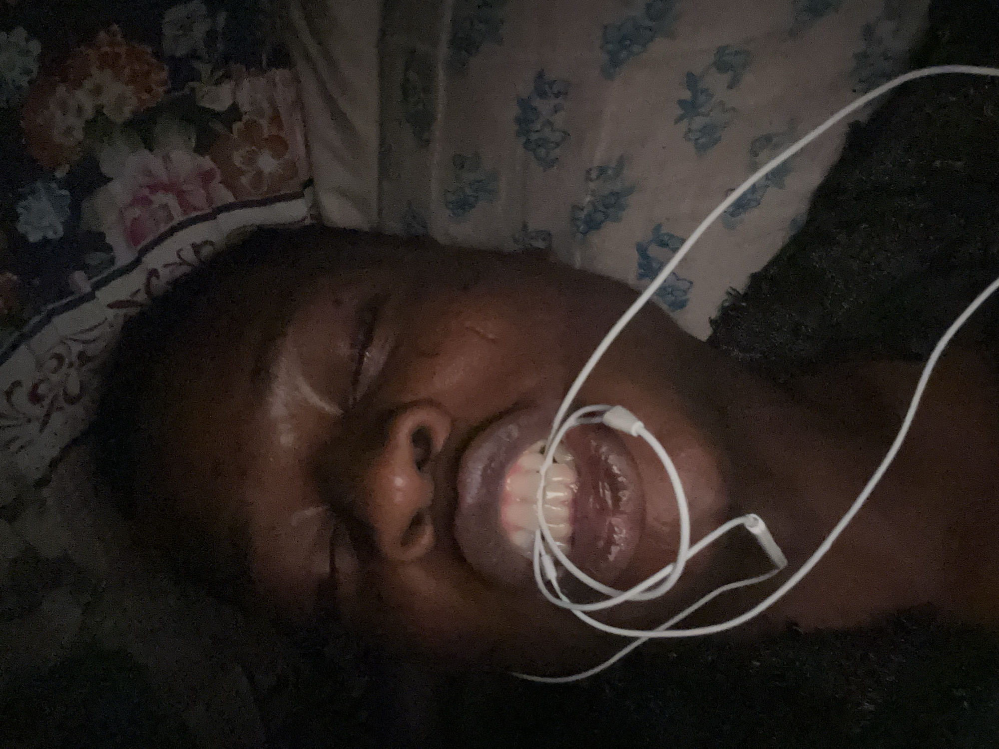 Person resting with earbuds captured in 22 sequential memories
