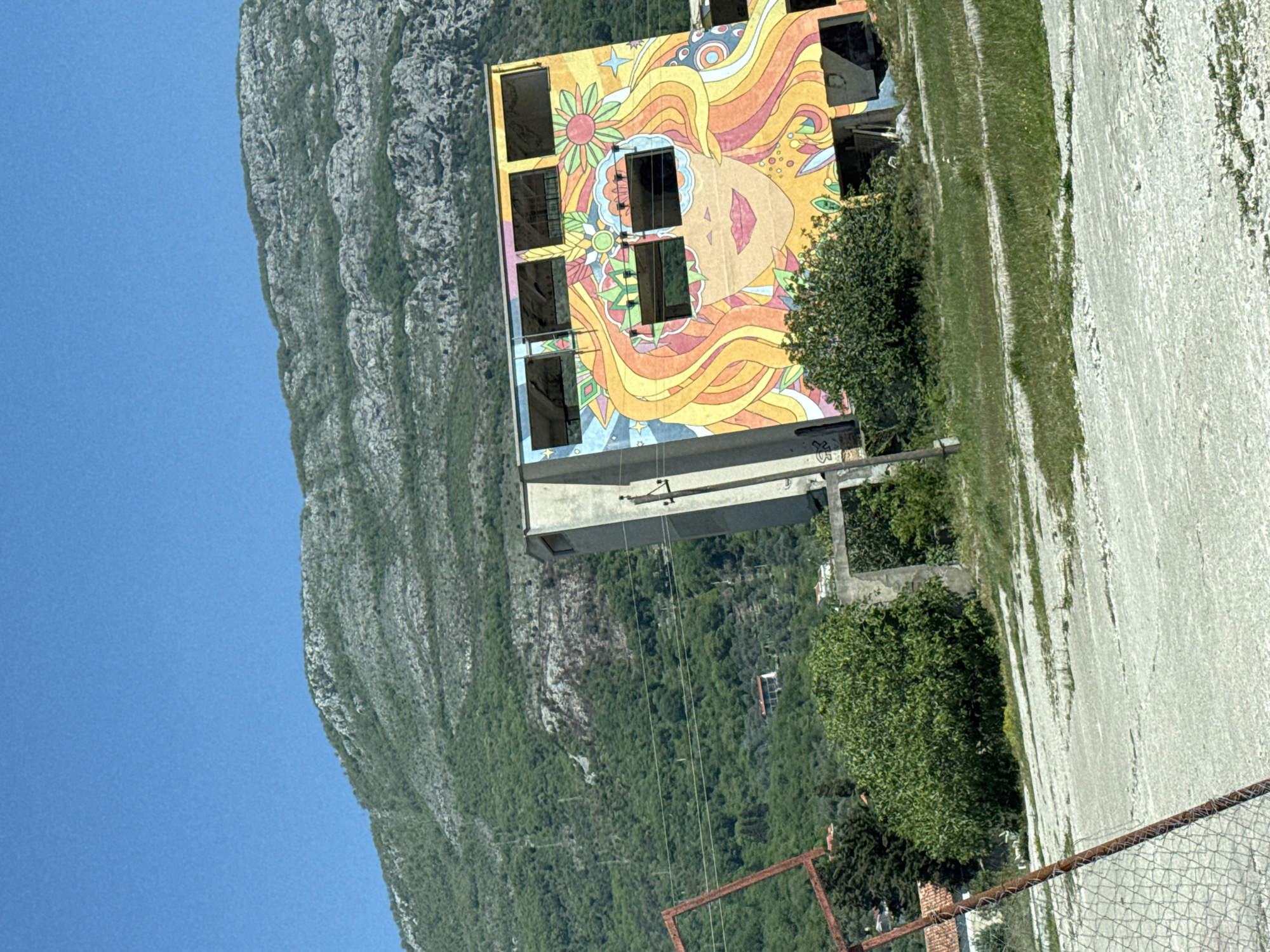 Colorful mural spotted on abandoned building in Buljarica, Montenegro