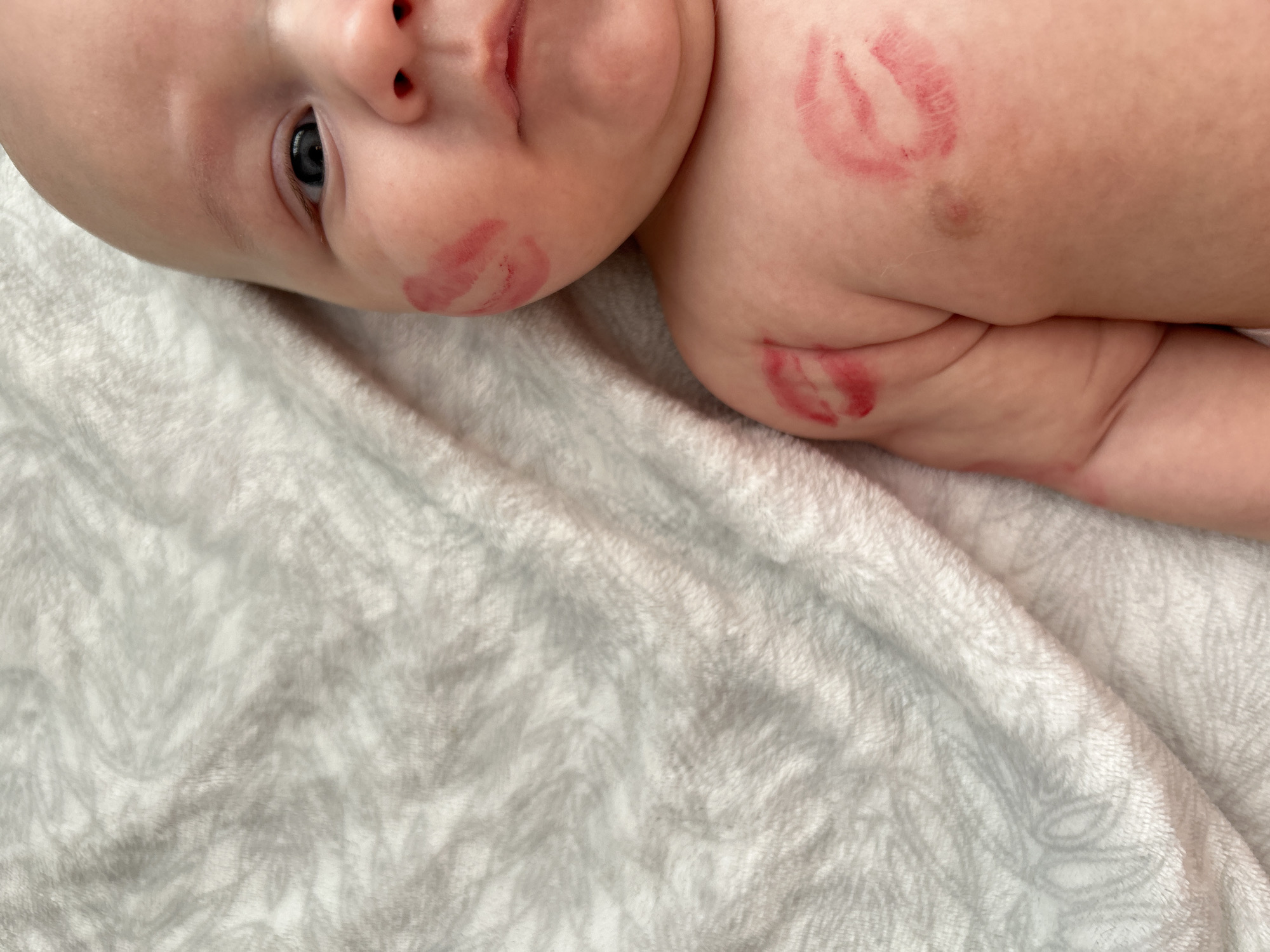 Baby photographed with lipstick kisses in Ufa, Russia