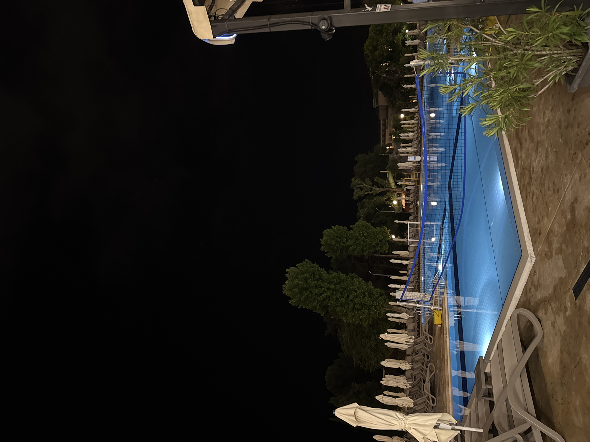 Evening documentation of quiet hotel resort with pools, buildings