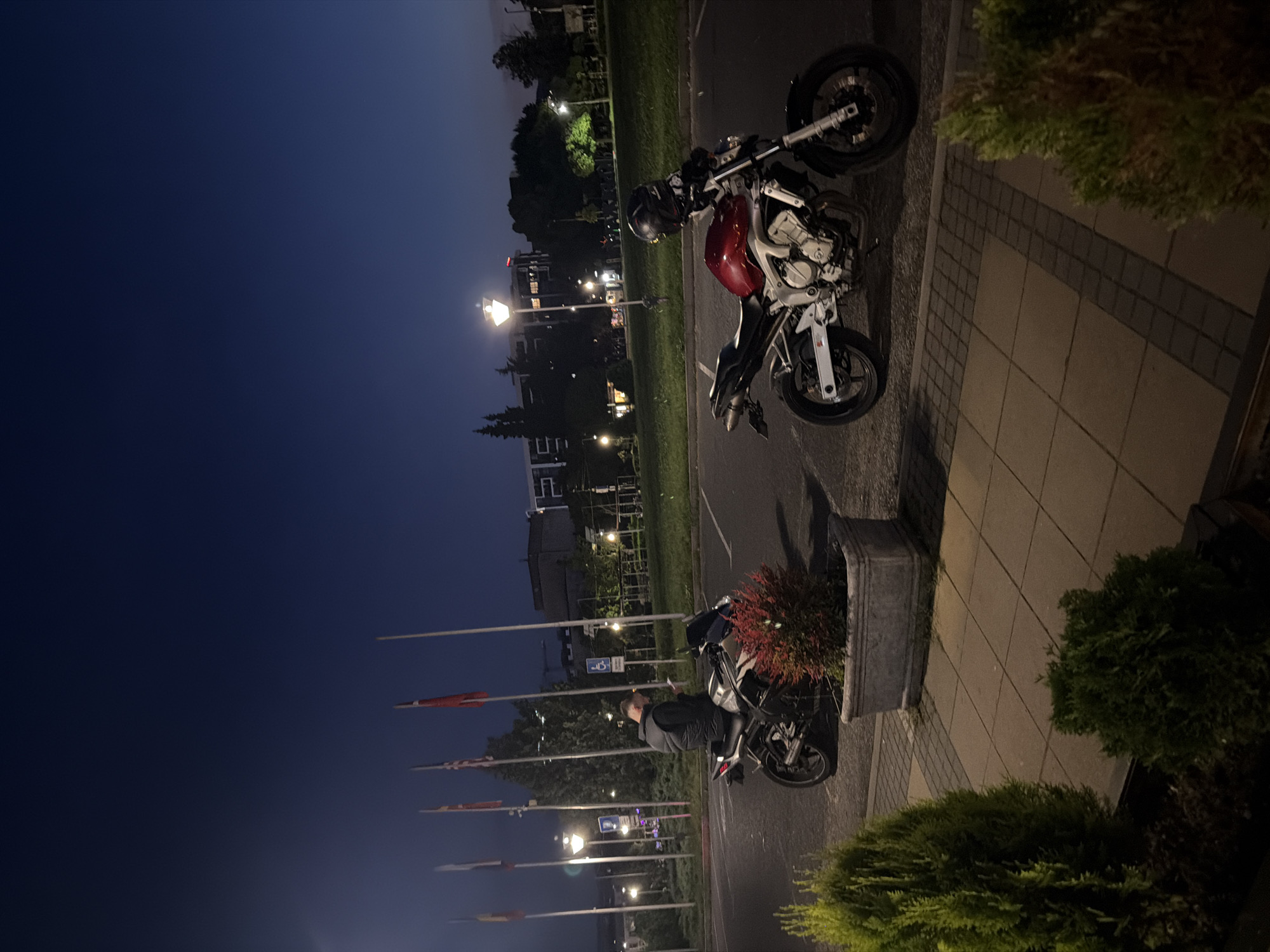 Two motorcycles parked on sidewalk in Kardzhali, Bulgaria