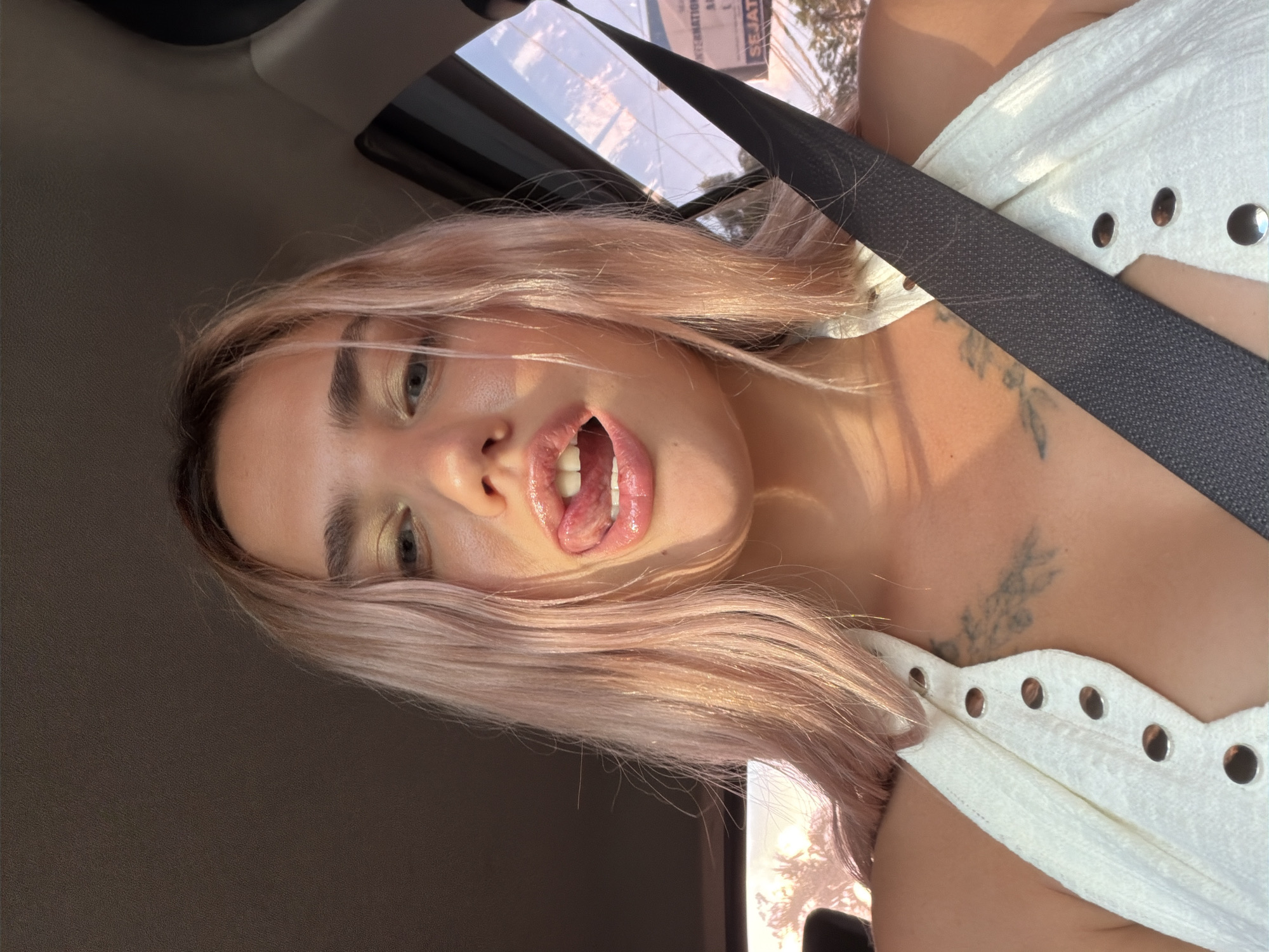 In-car selfie with a bold makeup look in Kuta