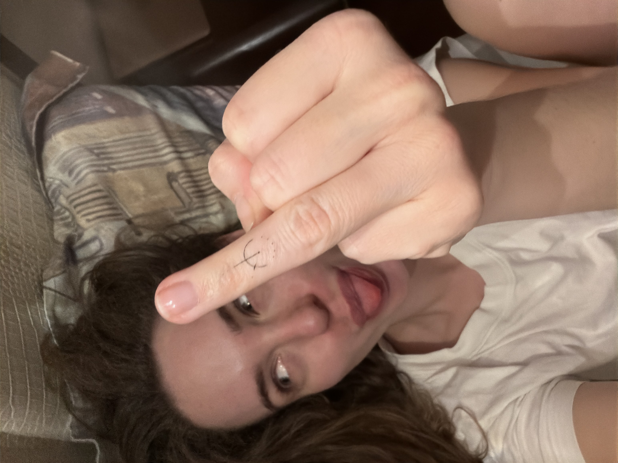 Woman photographed making gesture indoors in Khimki