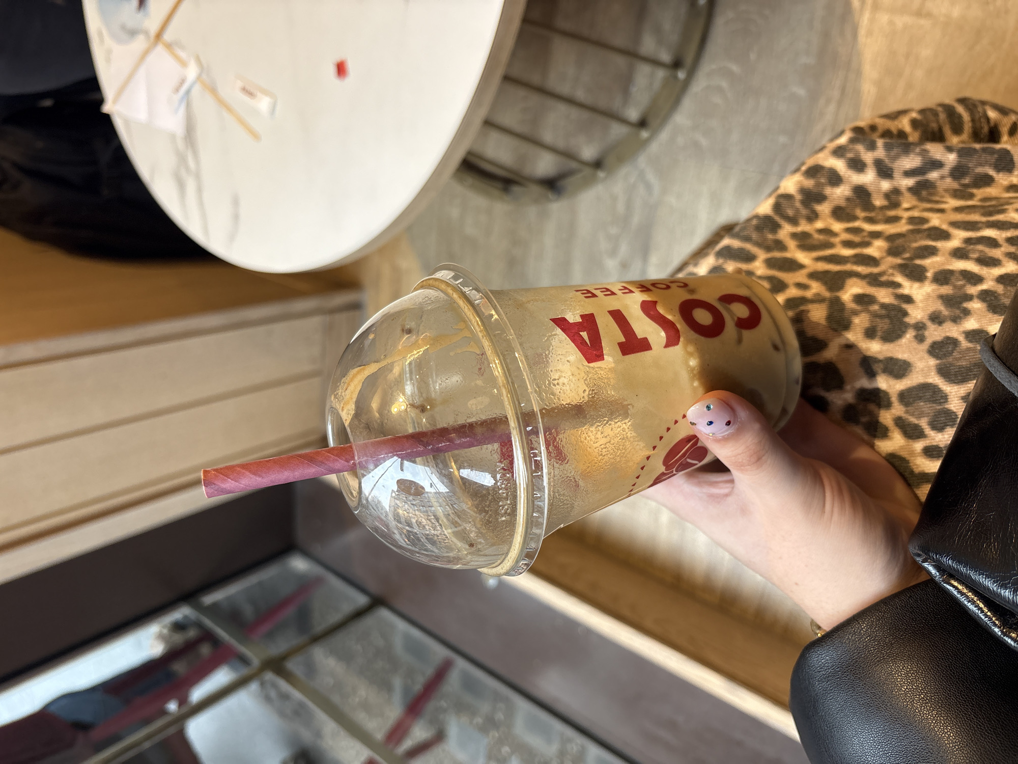 Woman enjoys Costa iced coffee in London