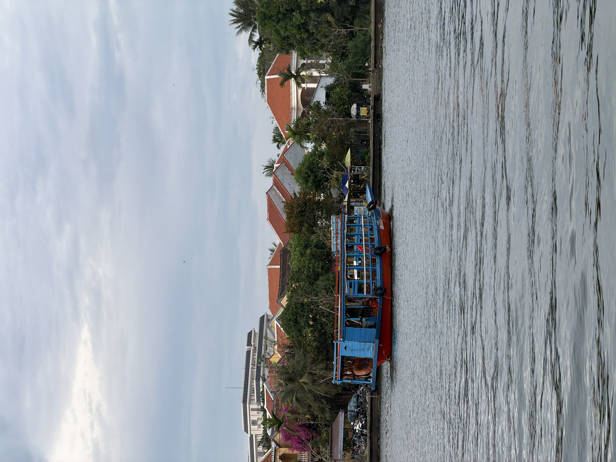 Vietnamese river boat tours feature traditional lantern painting activities