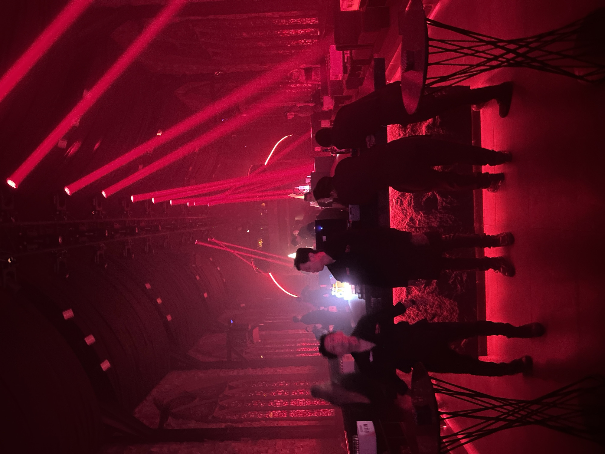 MU:IN Bali nightclub mid-show: costumed stage performance, red lights, full venue