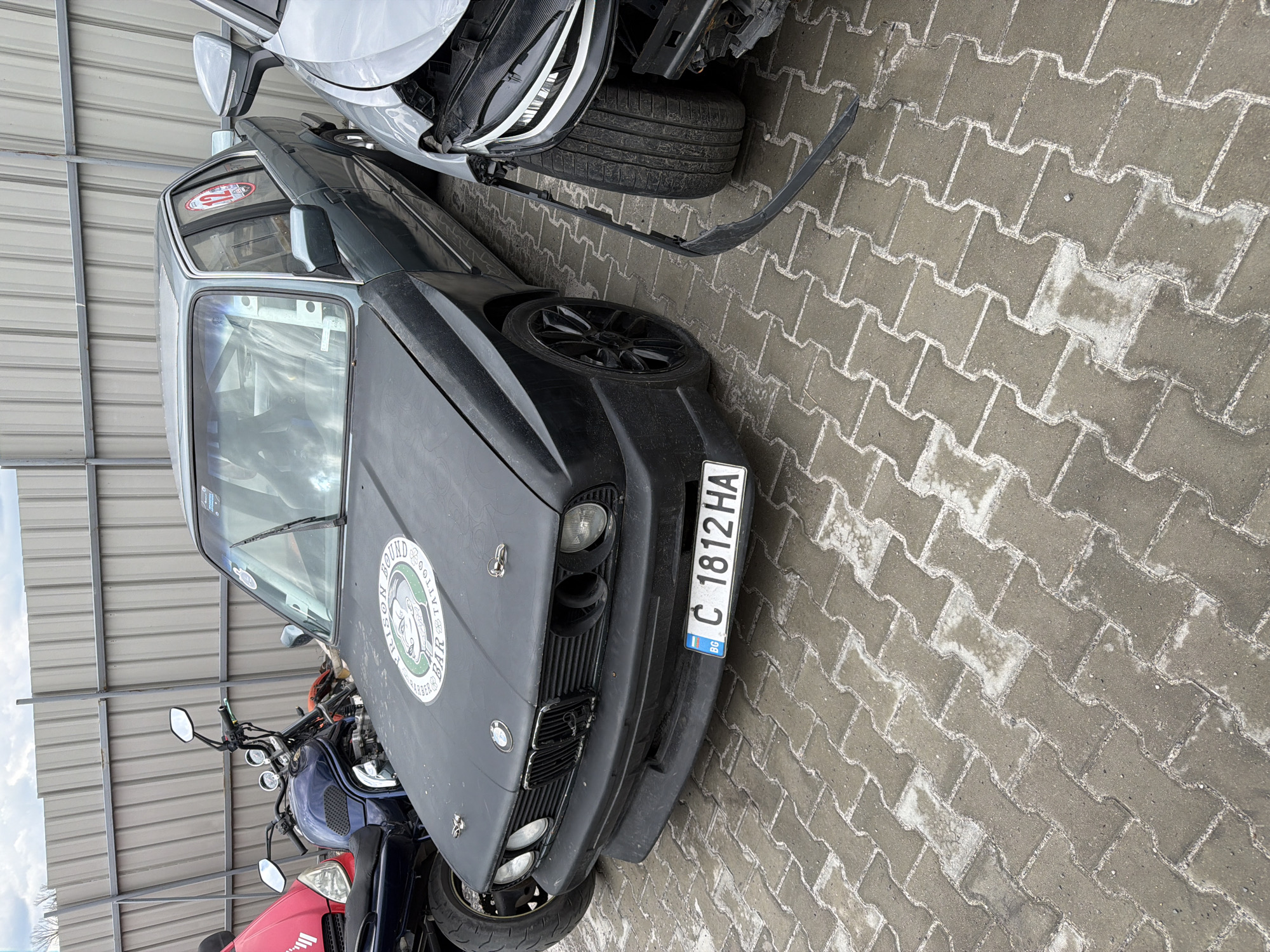 Vehicles parked at Sofia repair facility or junkyard