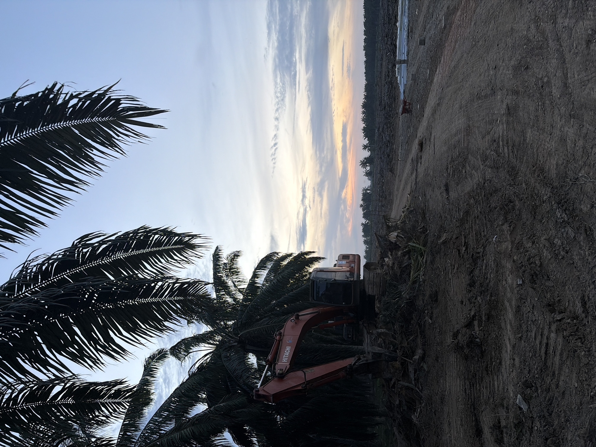 Construction site active in Simpangempat with excavator, workers