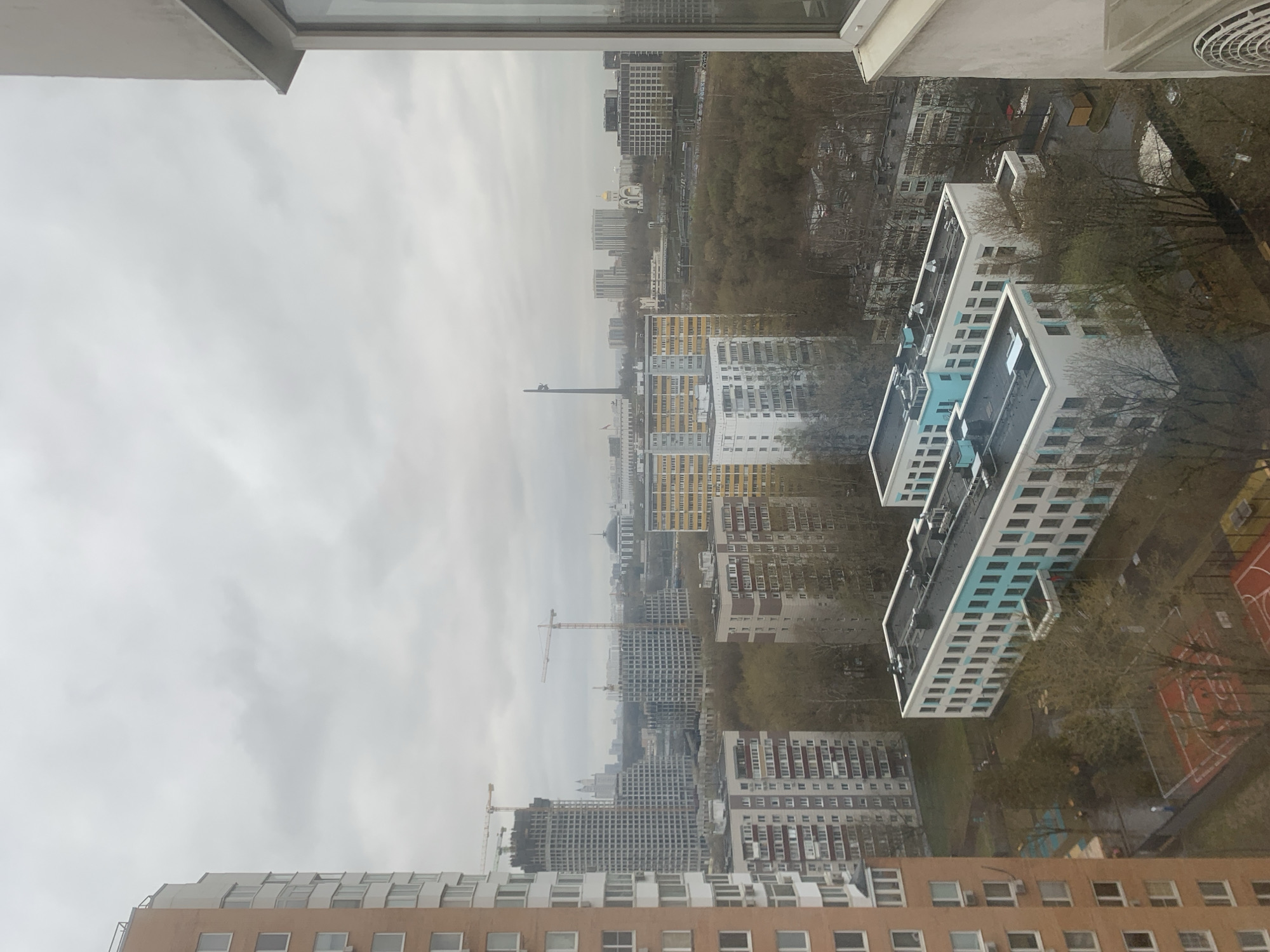 Overcast day photographed over Moscow's dense residential landscape