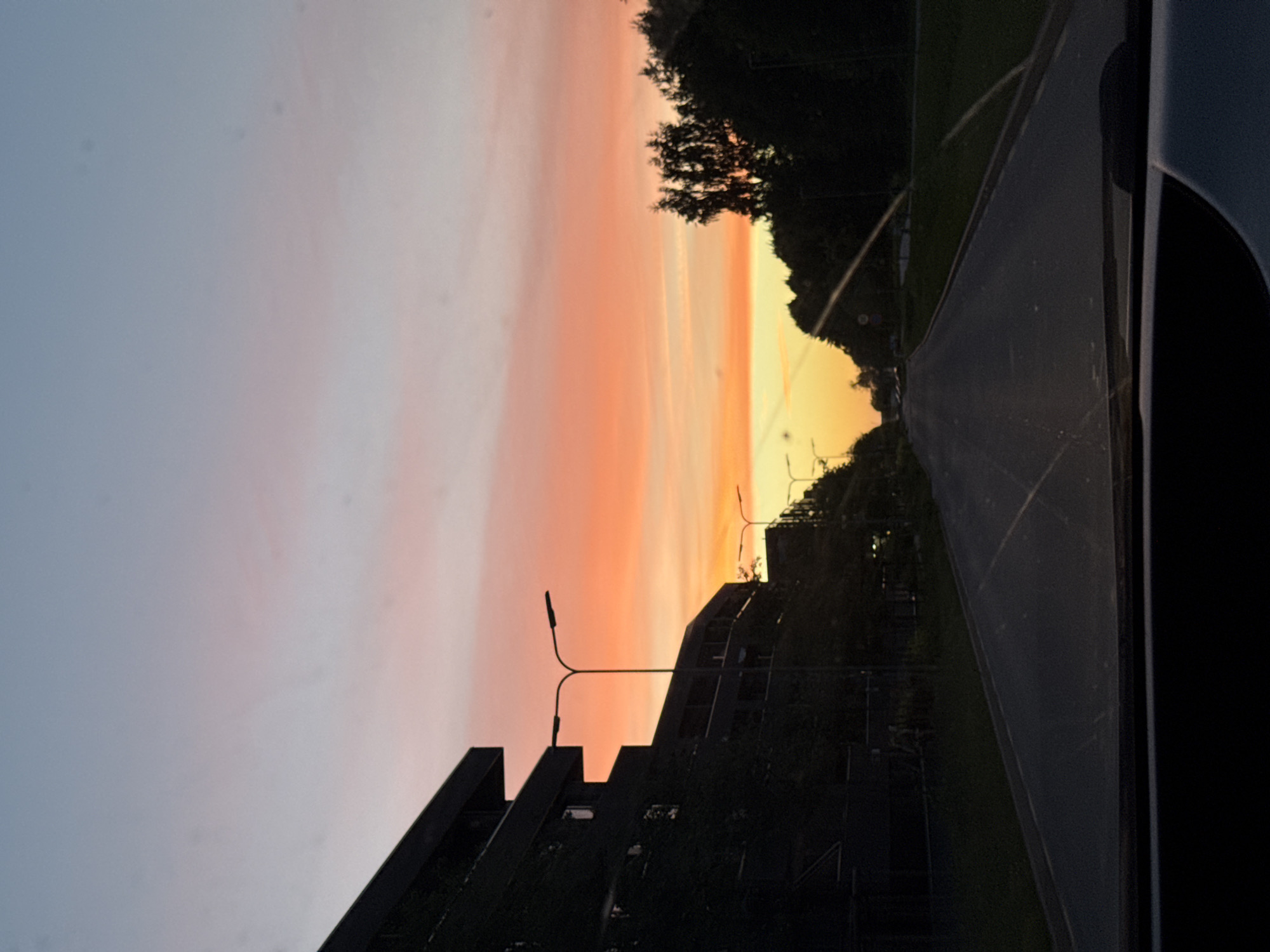 Driver captures vibrant sunset colors while traveling through Tallinn
