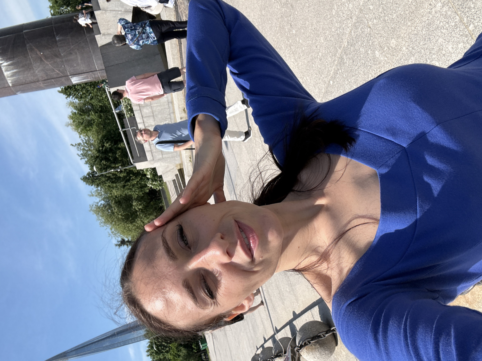 Woman takes selfies at Saint Petersburg landmarks during sunny morning