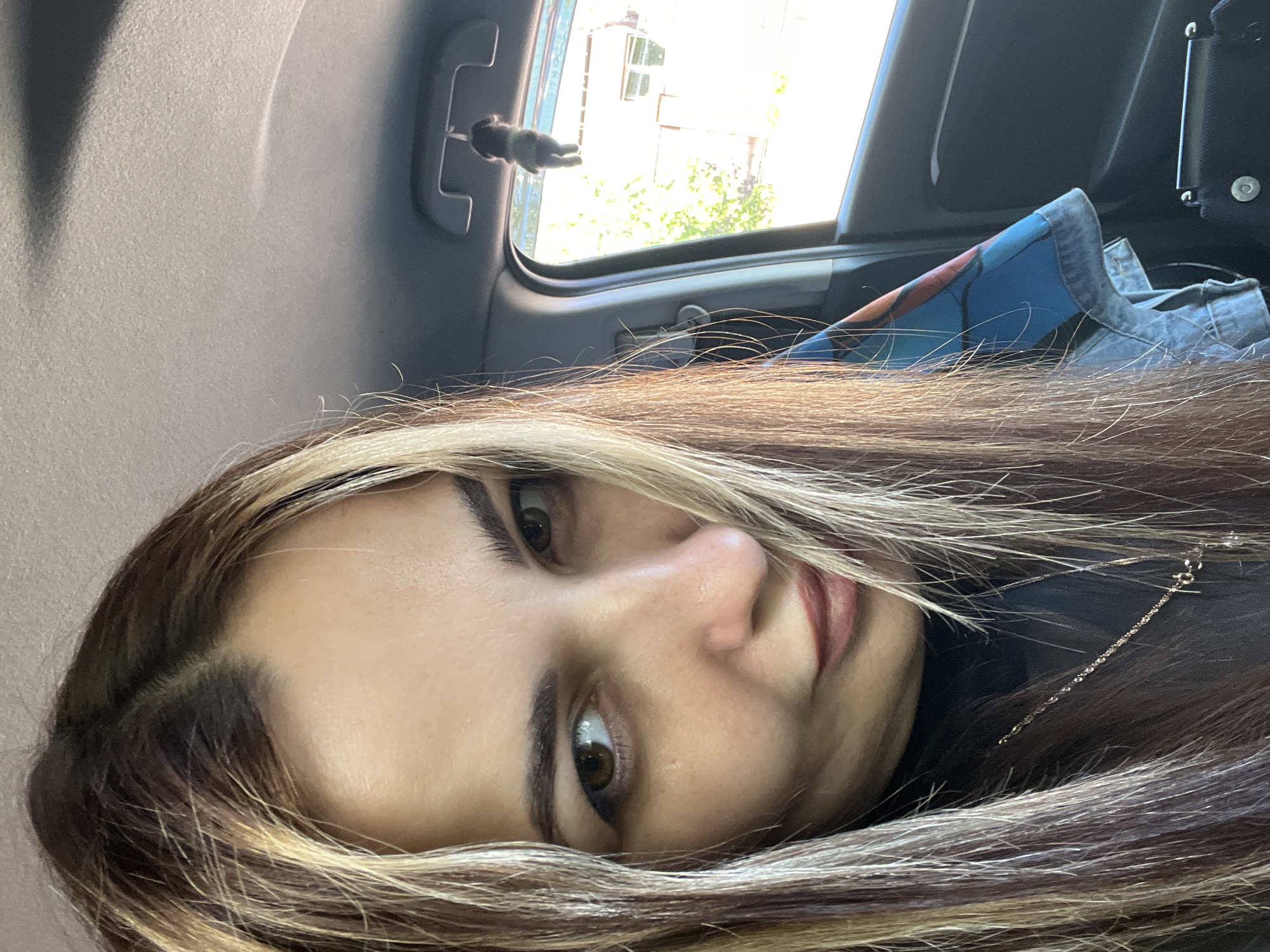 Woman takes car selfies during late night drive