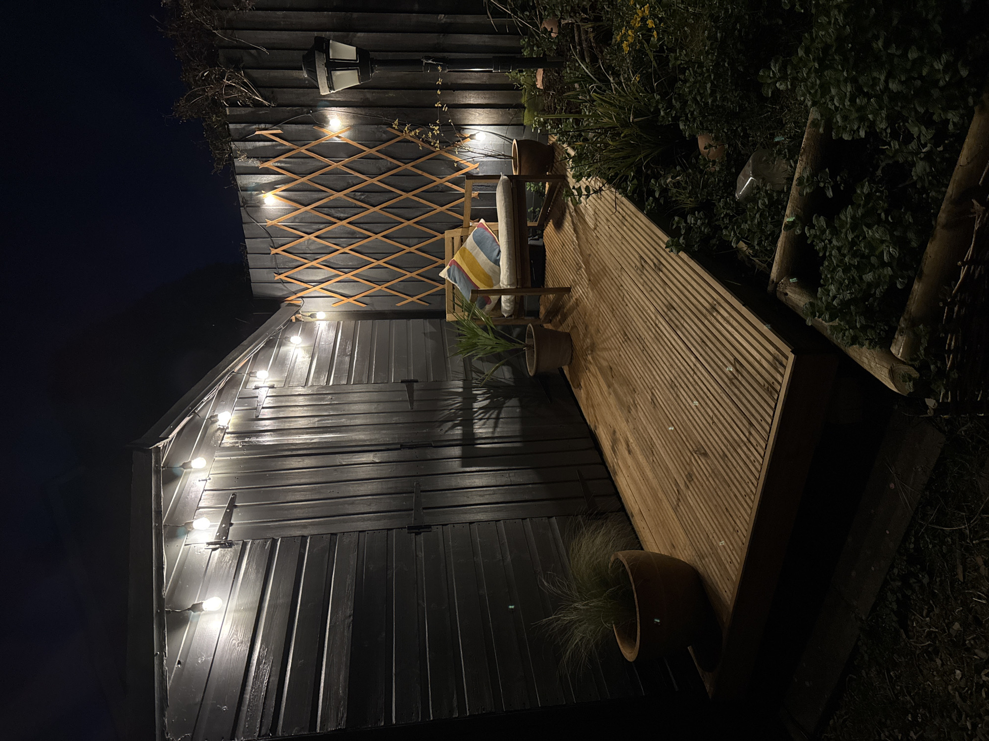 Evening outdoor space illuminated by decorative lights in South Kesteven