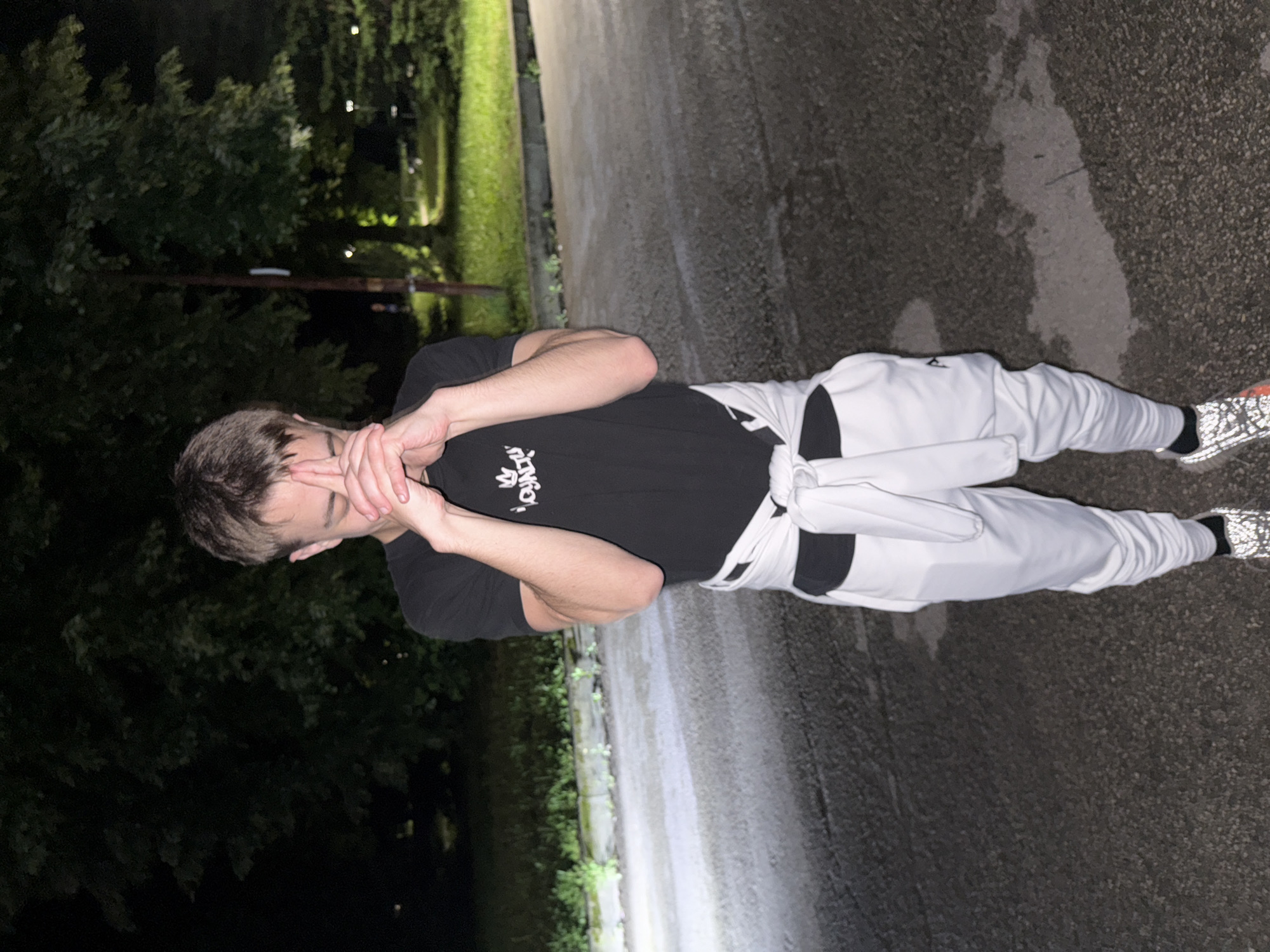Young men gather for nighttime photos in Sevlievo, Bulgaria