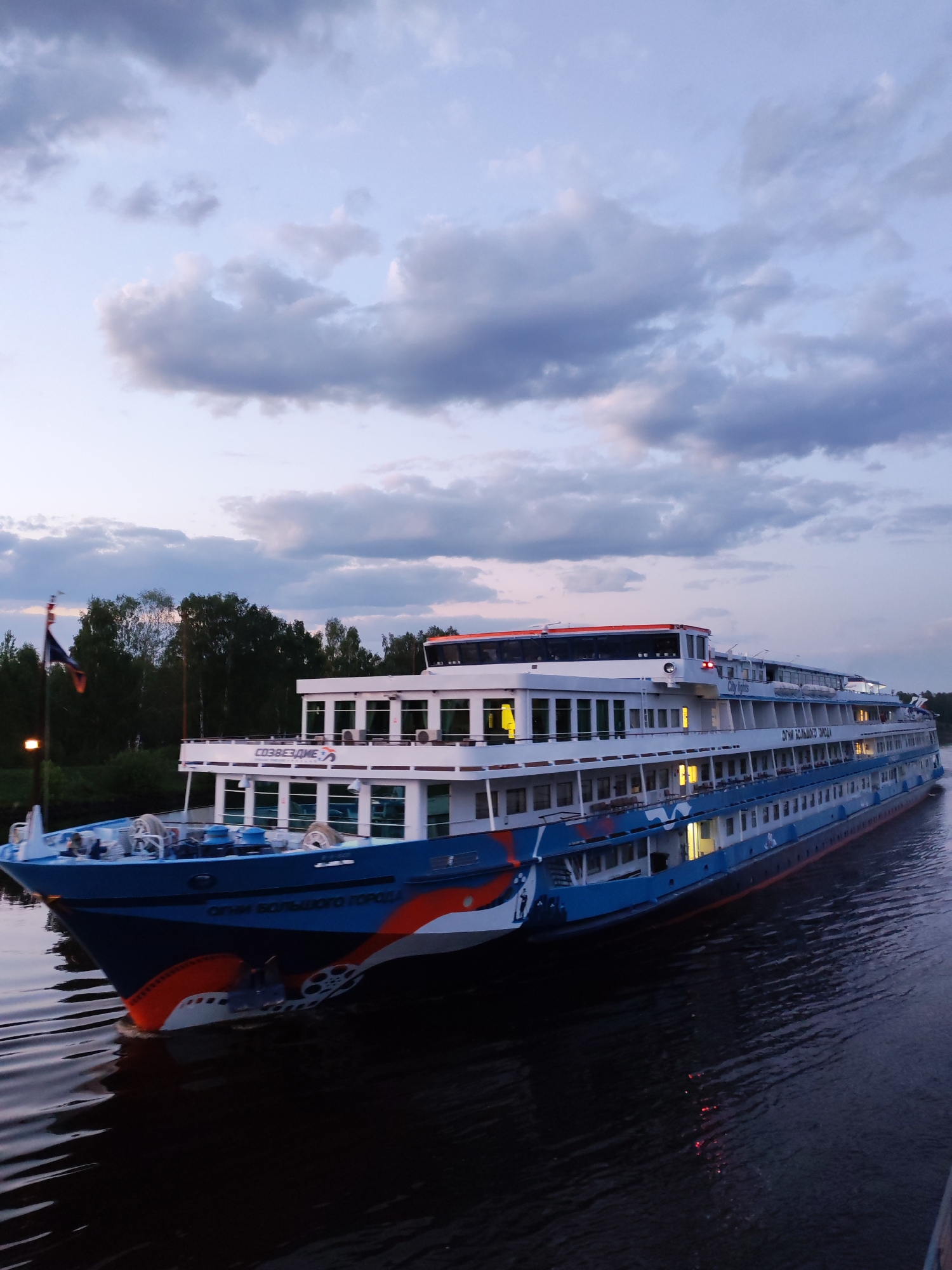 Cruise ship travels Moscow Canal near Zaprudnya at dusk
