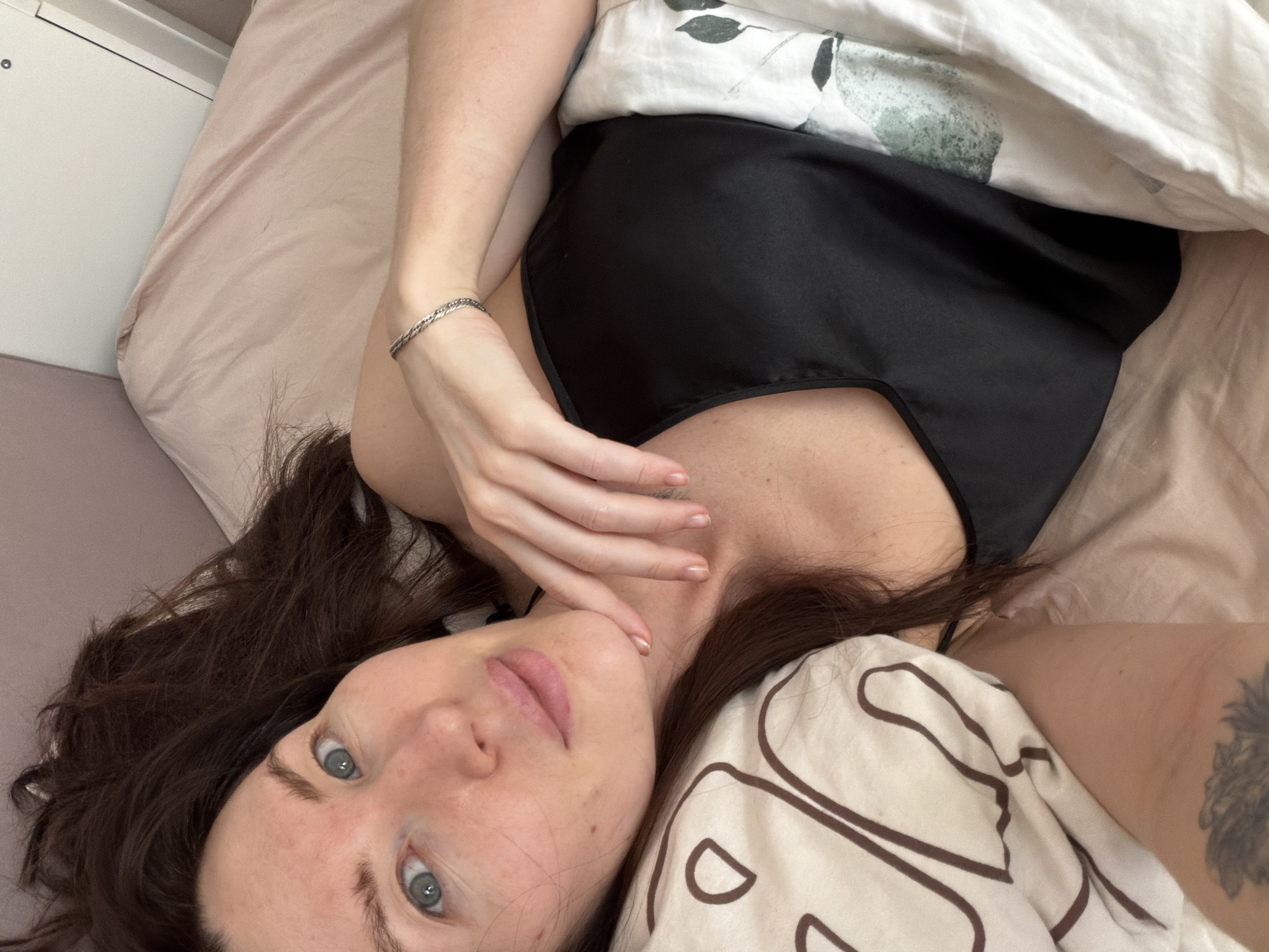 Woman takes morning selfie in bed in Perm