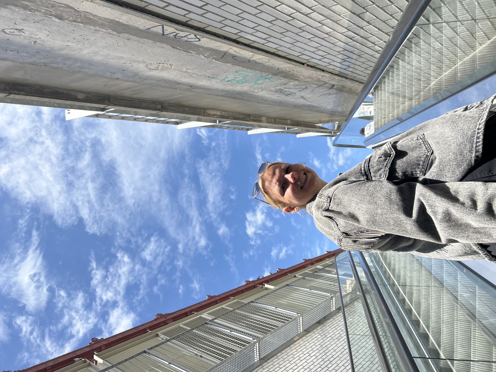 Barcelona residents document urban moments on pedestrian bridge, interior space