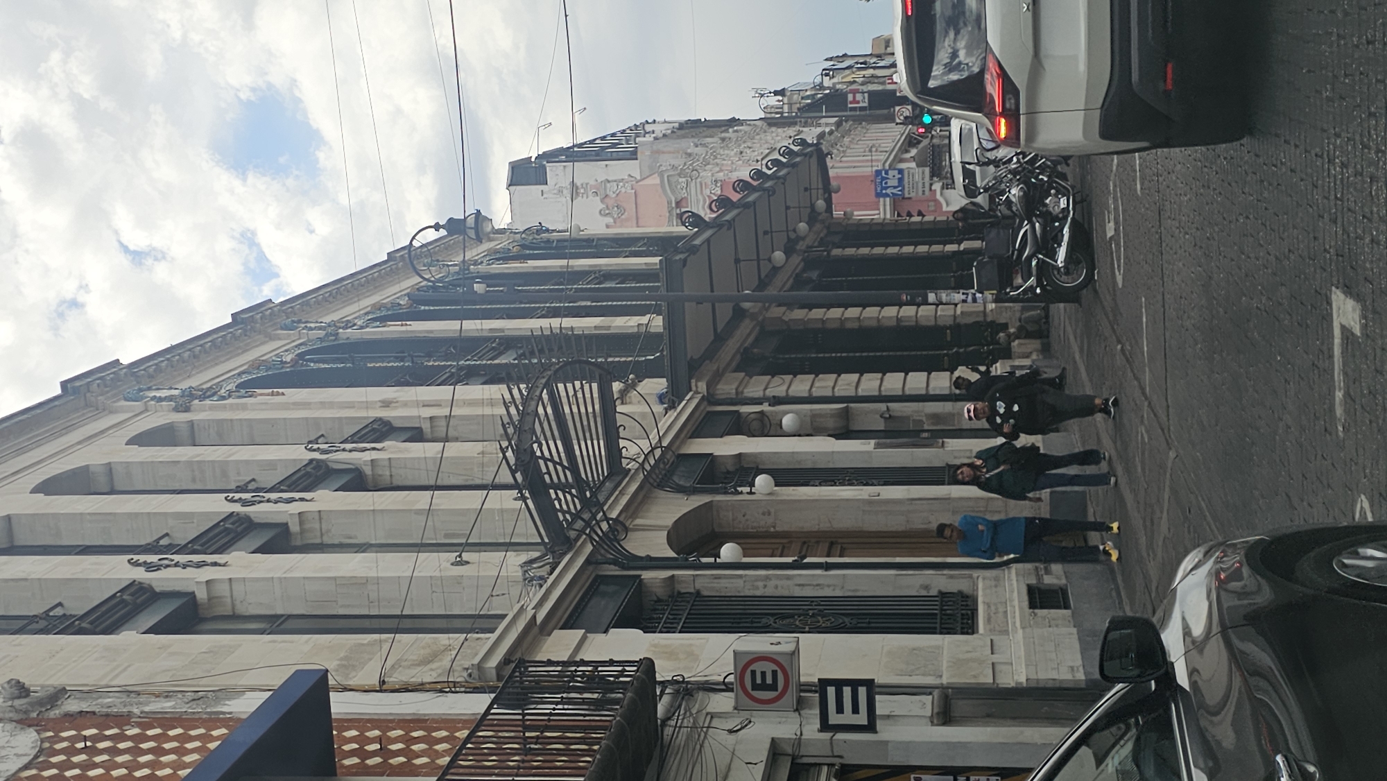 Street scene captured in Puebla showing white architectural building