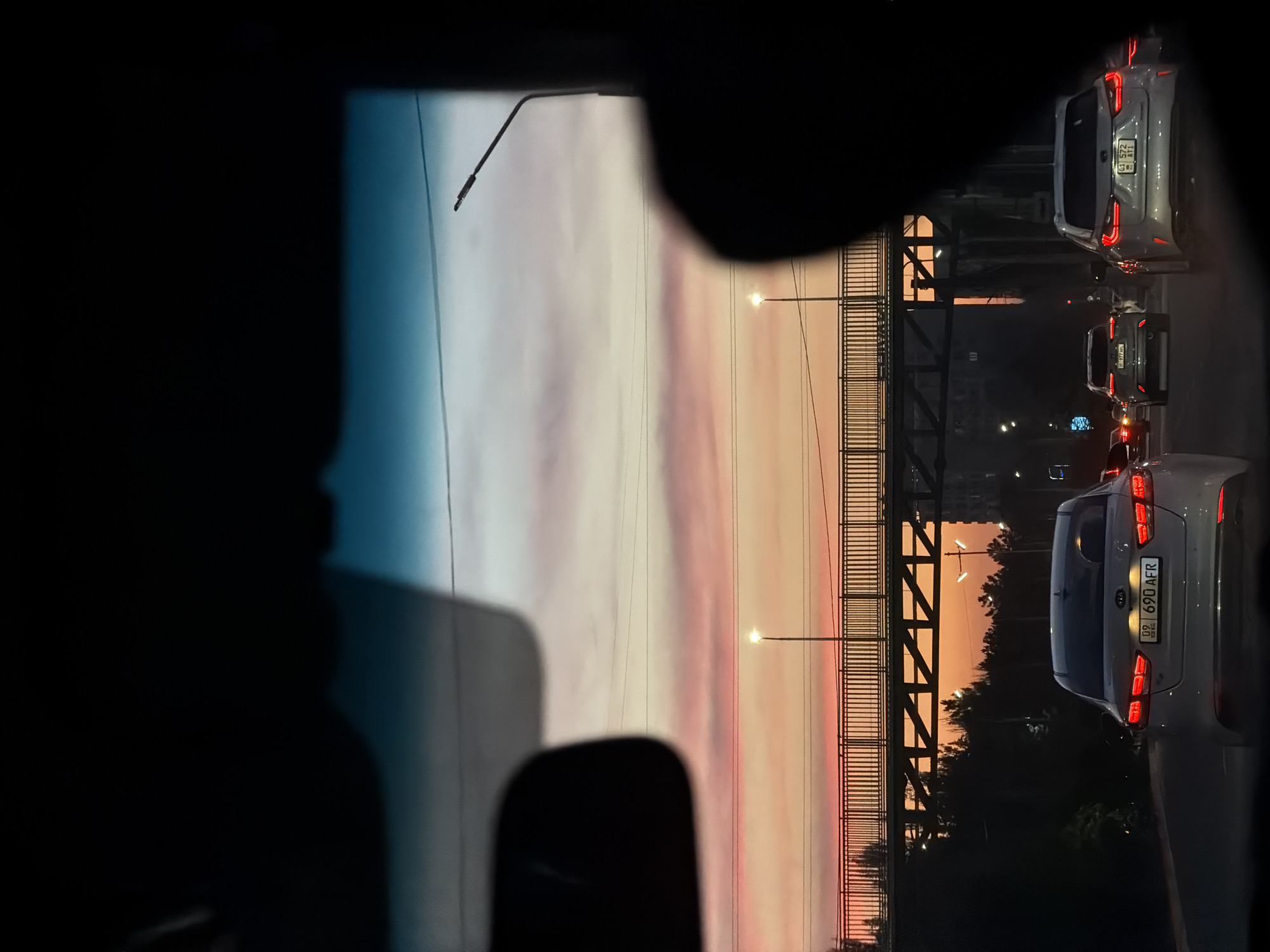 Driver captures street views during evening commute in Bishkek