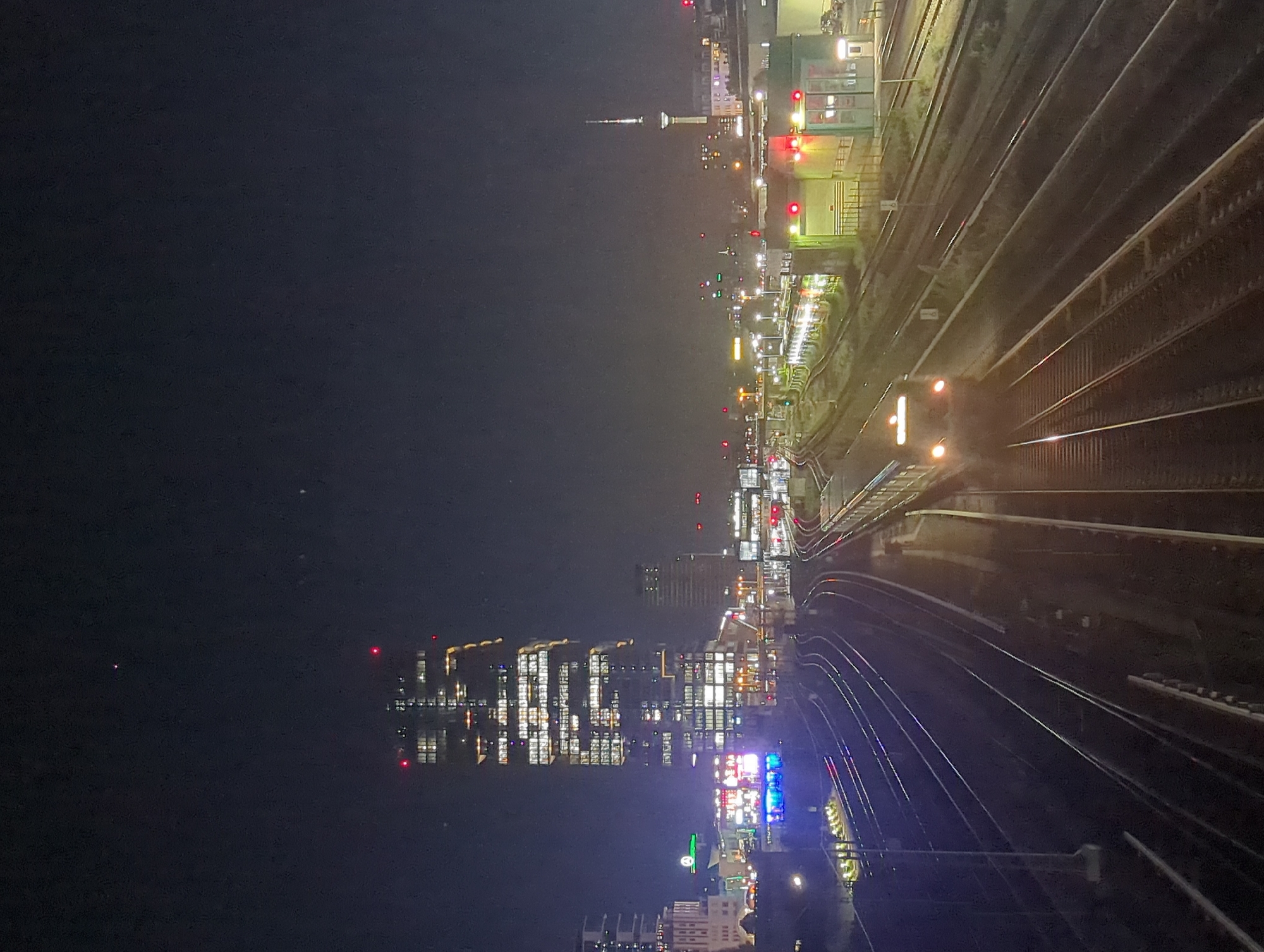 Nighttime Berlin cityscape captured from elevated train position