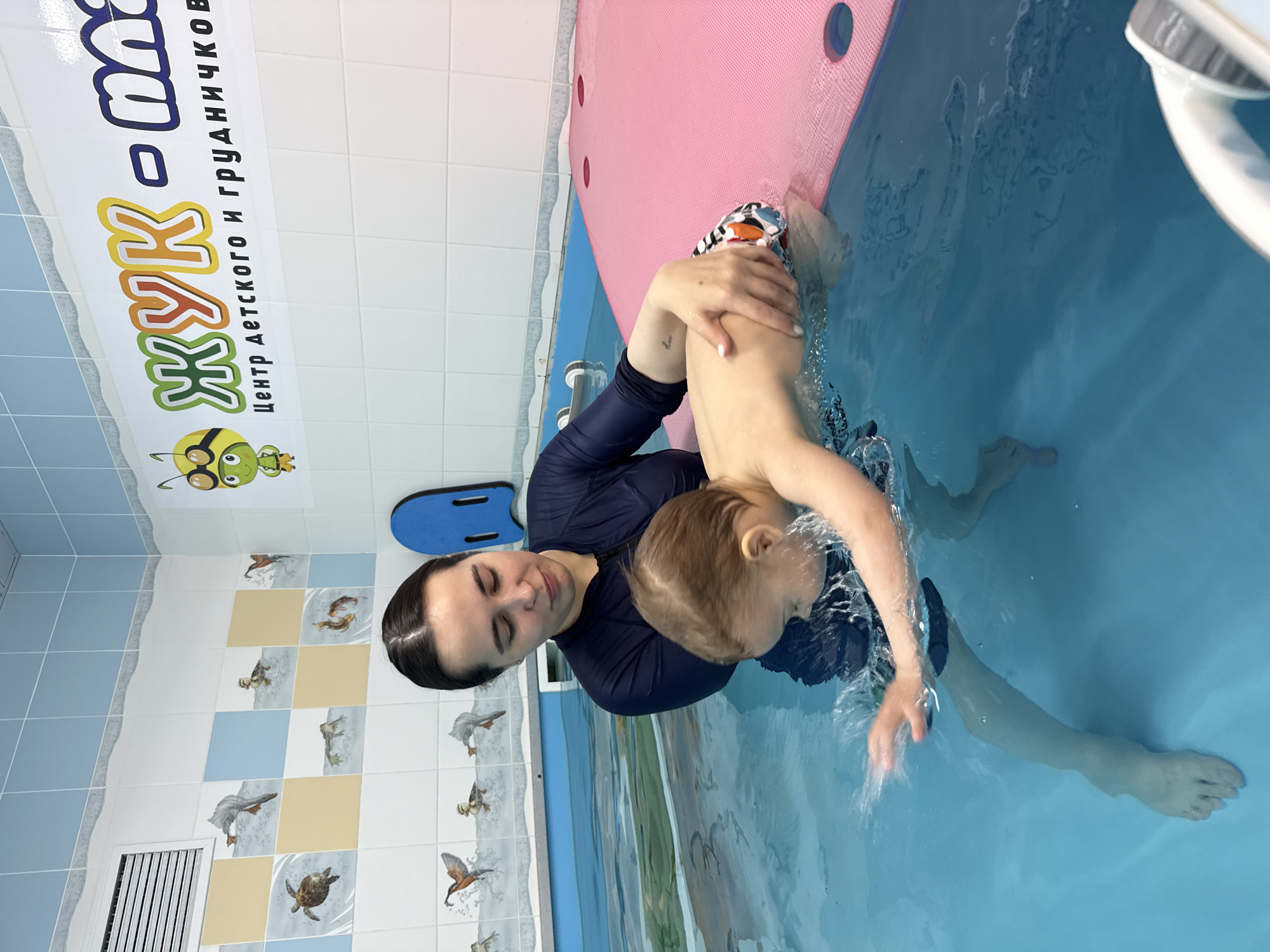 Swimming lesson observed between woman and child in Russia