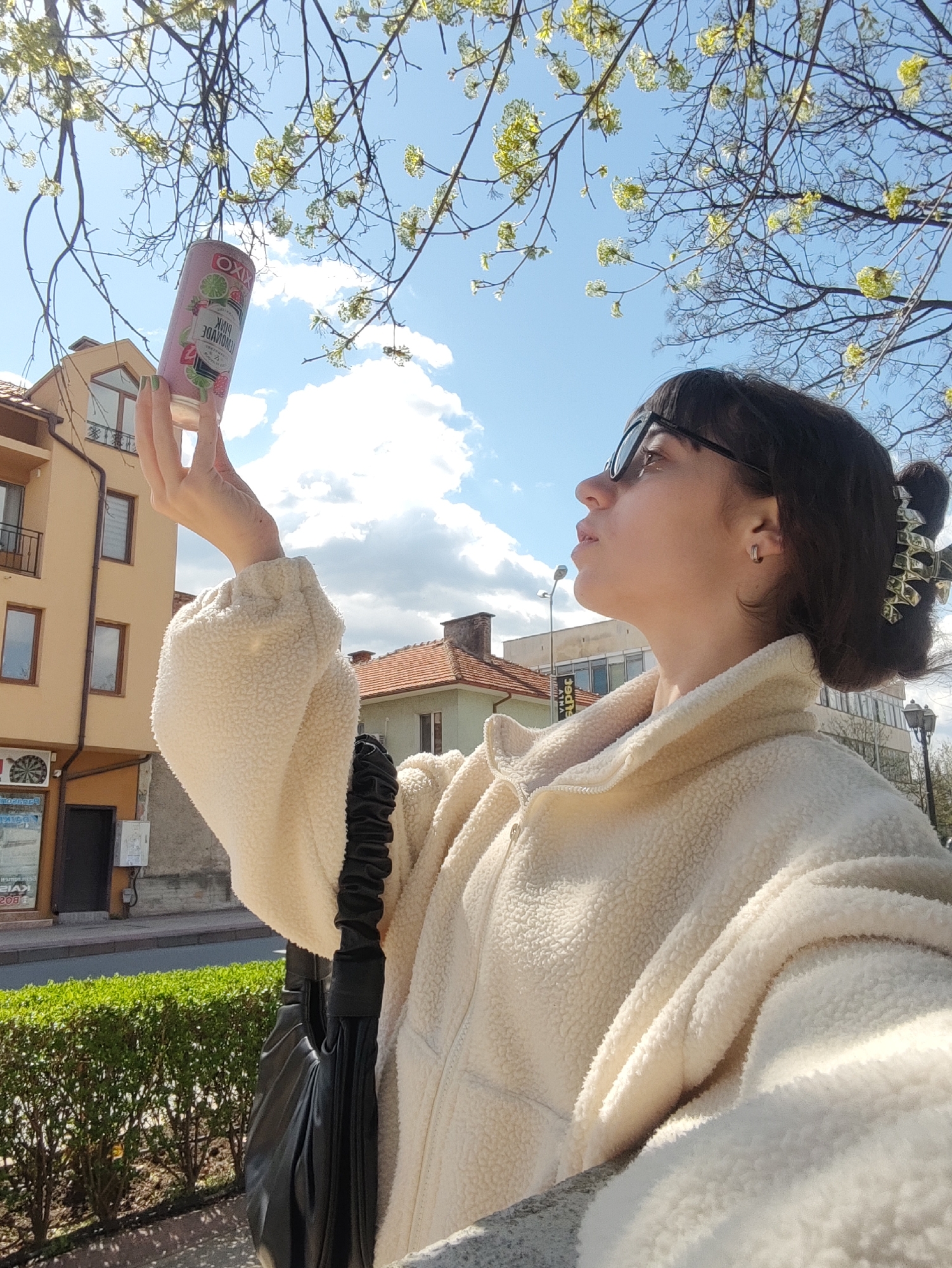 Woman takes selfie with pink drink on Sliven street