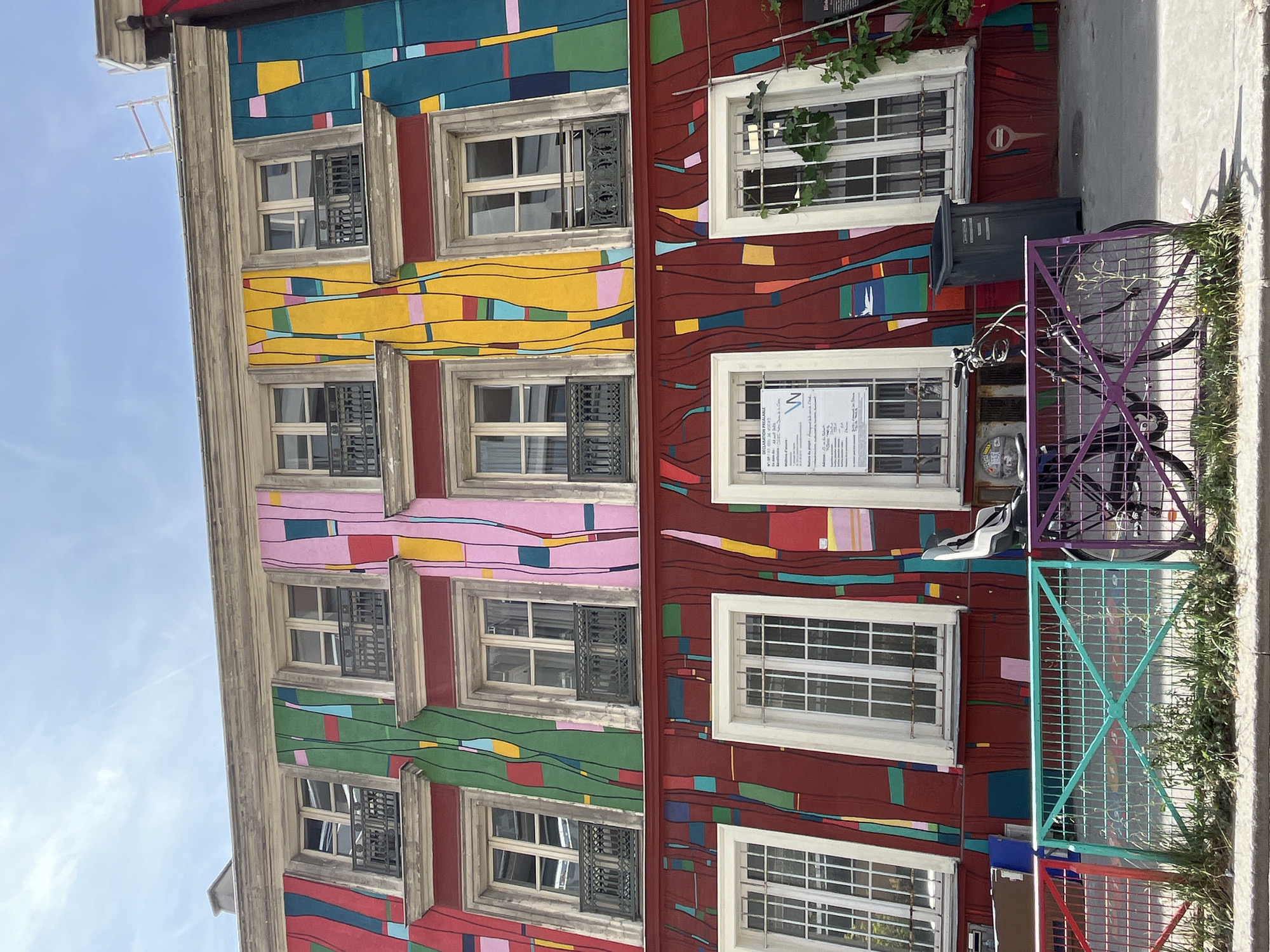 Paris street murals and fire-damaged apartments, July 2026