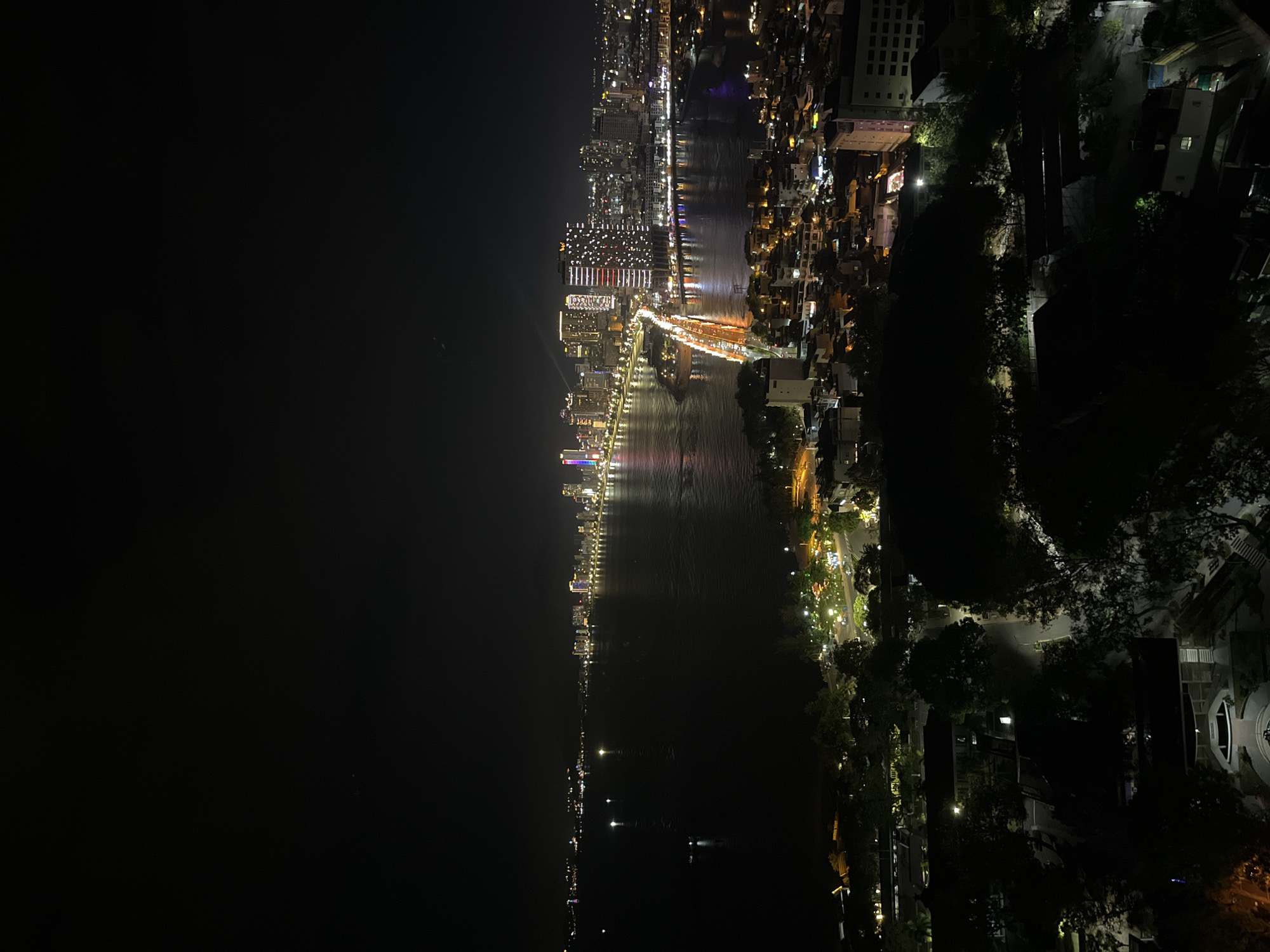 Aerial nighttime city views captured showing waterfront urban development