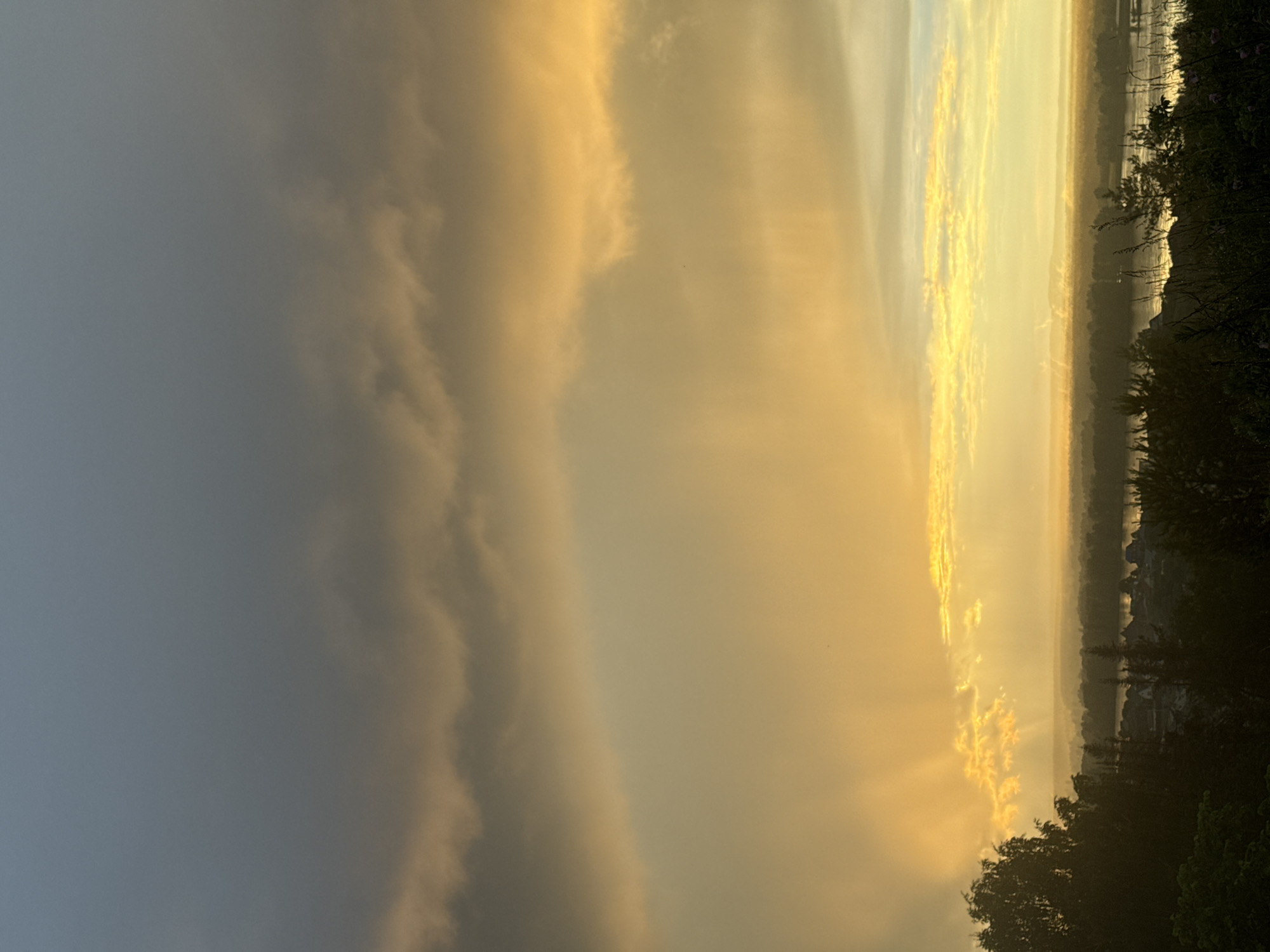 Dramatic sunset illuminates Russian villages amid stormy skies