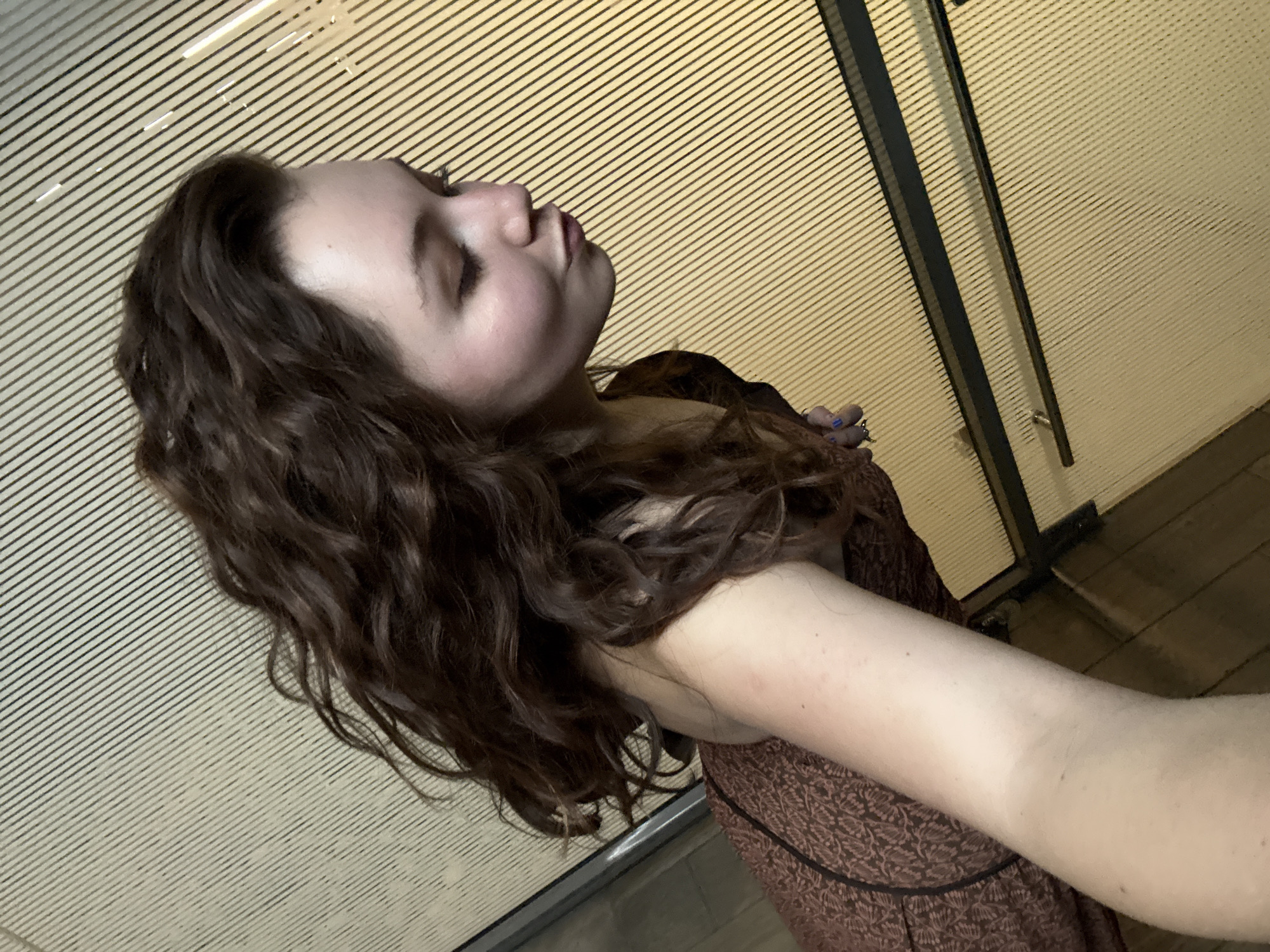 Woman takes selfies in Mexico City elevator, subway area