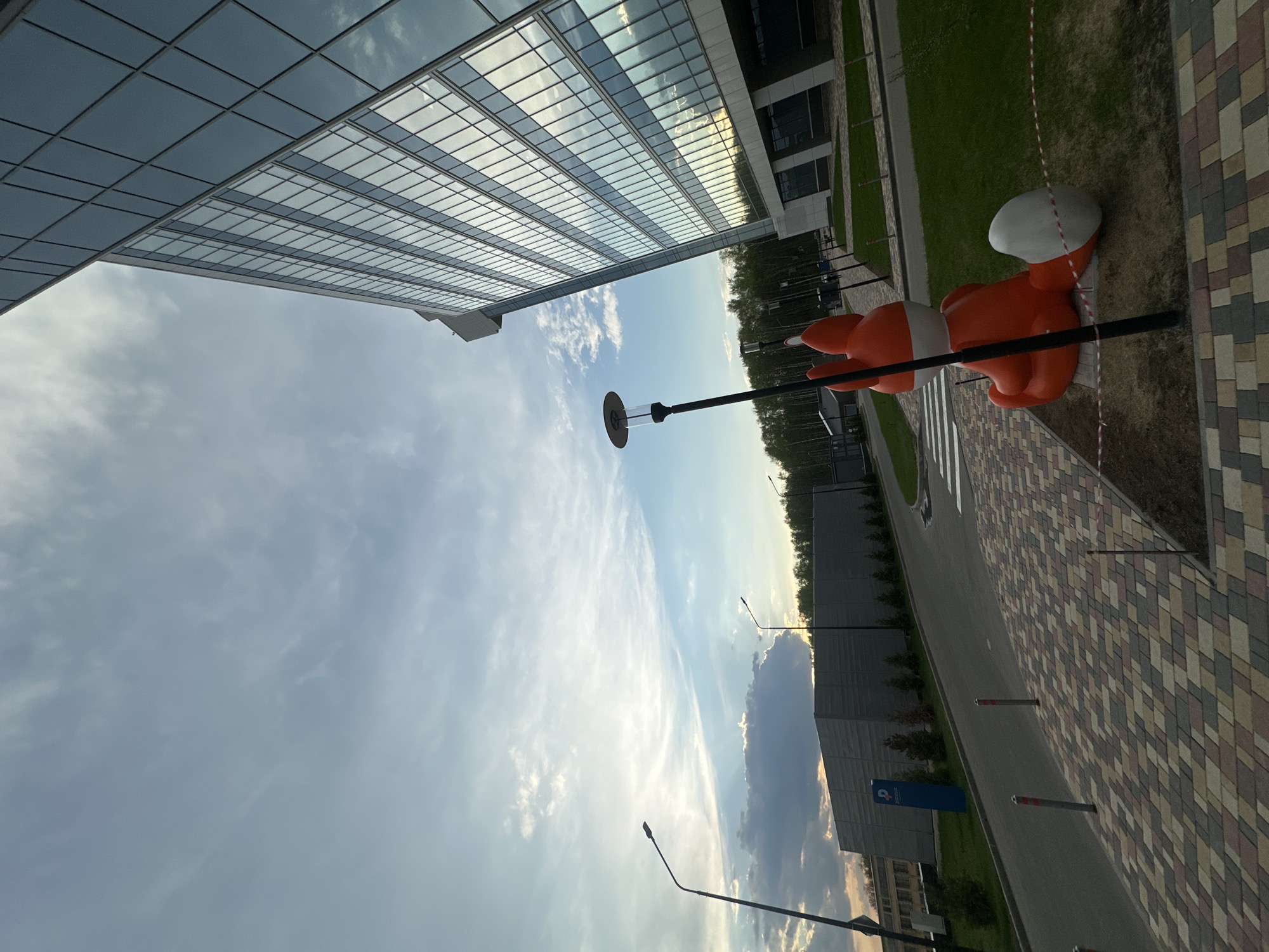 Orange fox sculpture spotted on Moscow street amid dramatic clouds