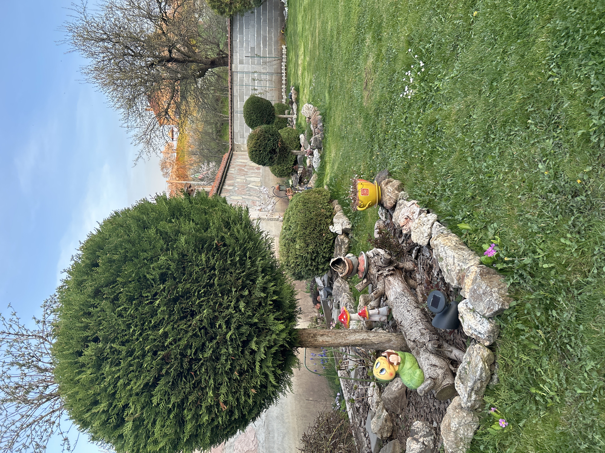 Residential garden with decorative landscaping documented in Buhovo, Bulgaria