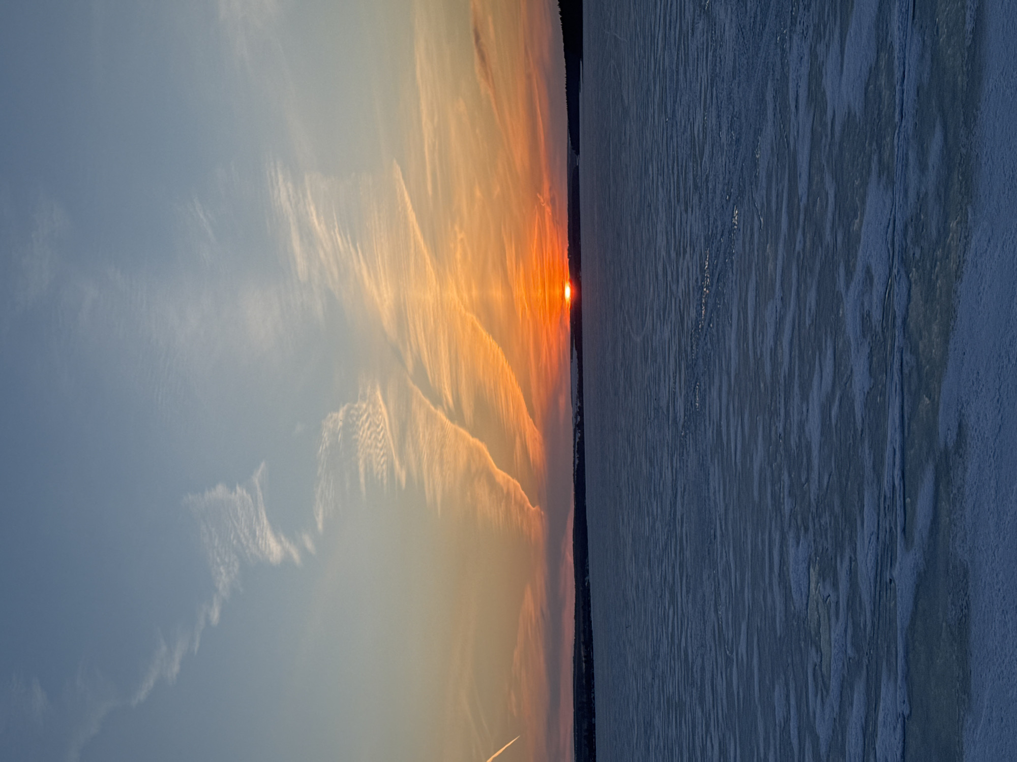 Sunset observed over frozen reservoir in Votkinsk Russia