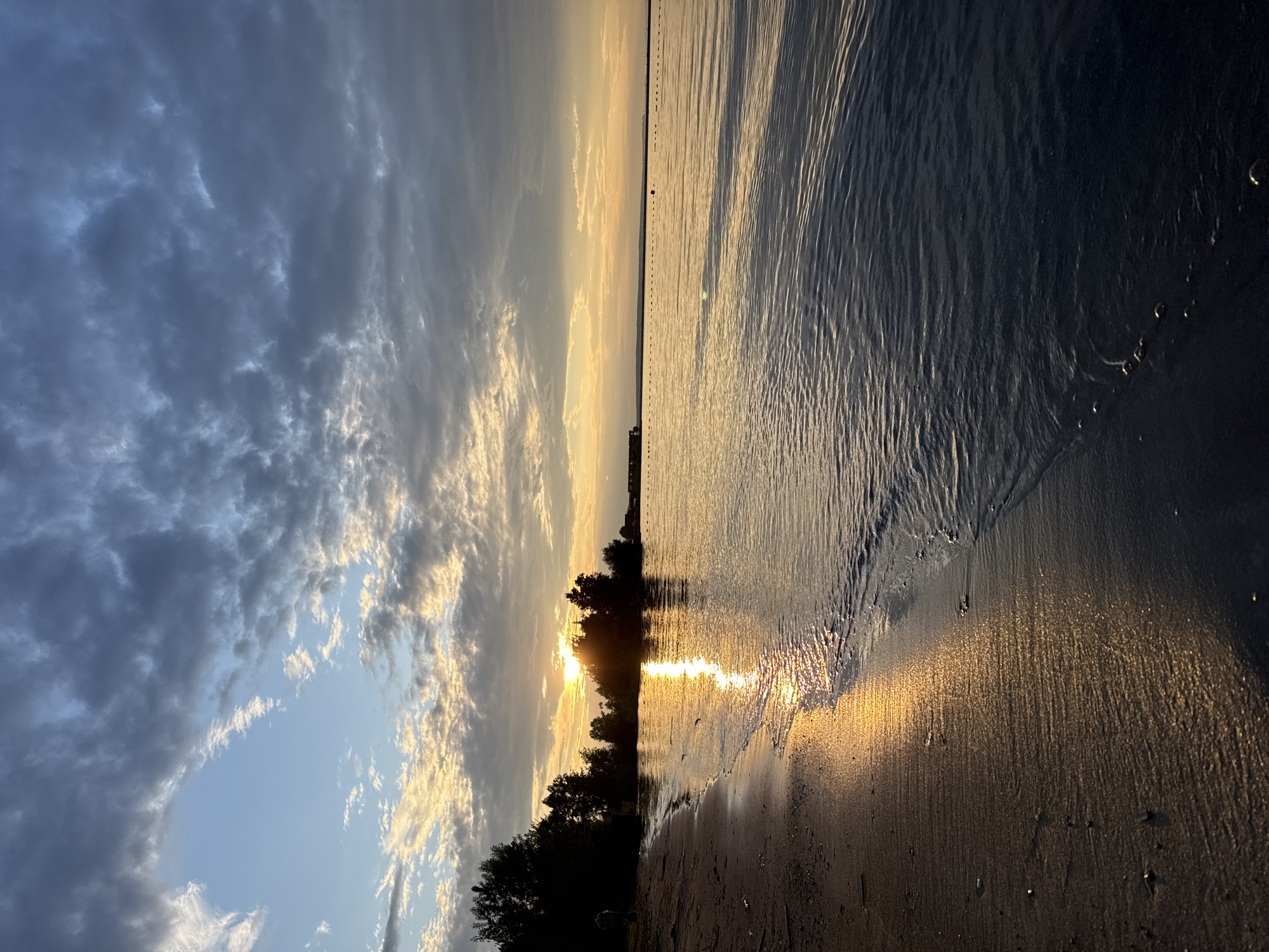 Friends enjoy sunset beach gathering in Chaikovsky, Russia