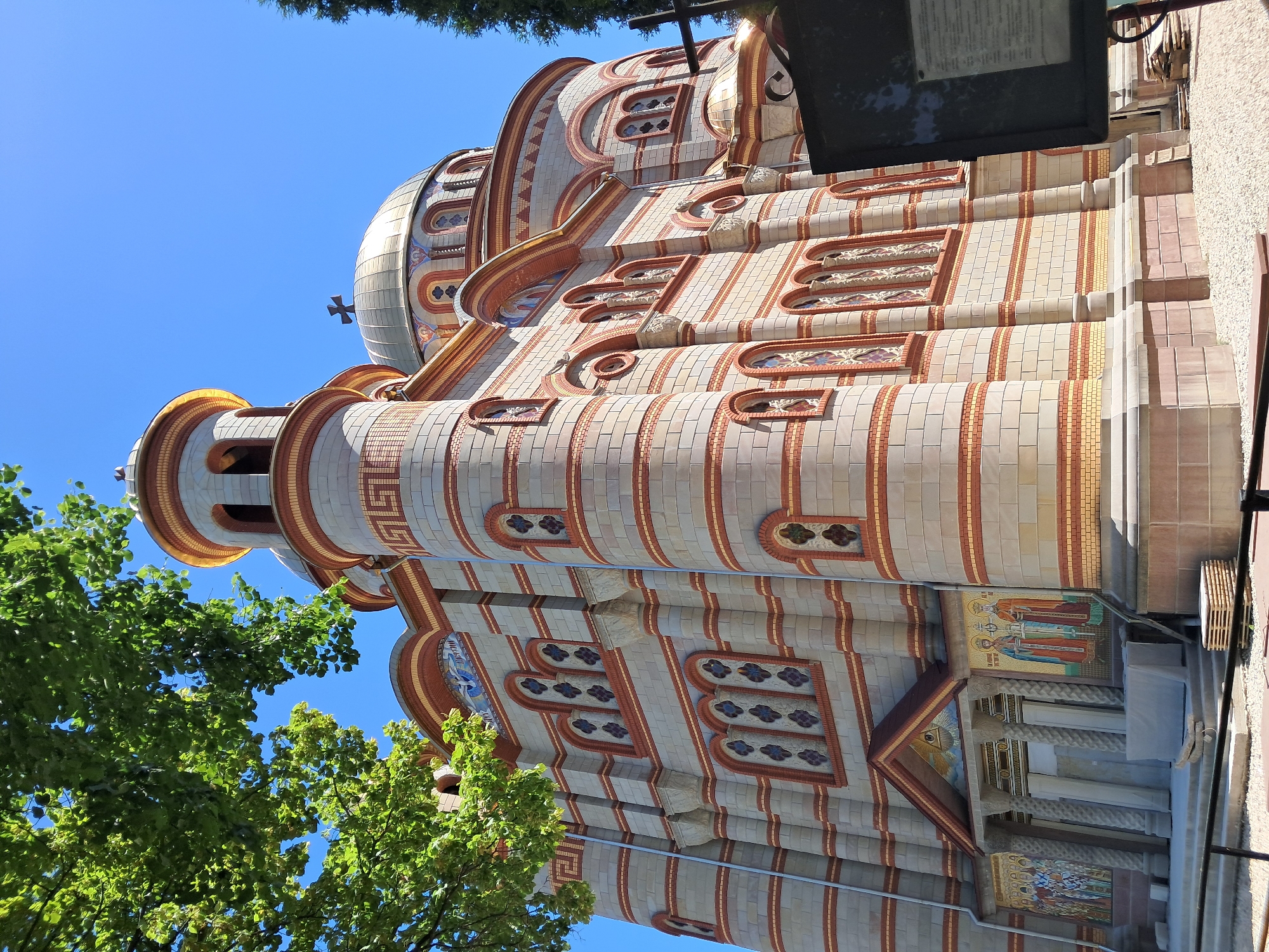 Ice cream and street life near a grand domed church