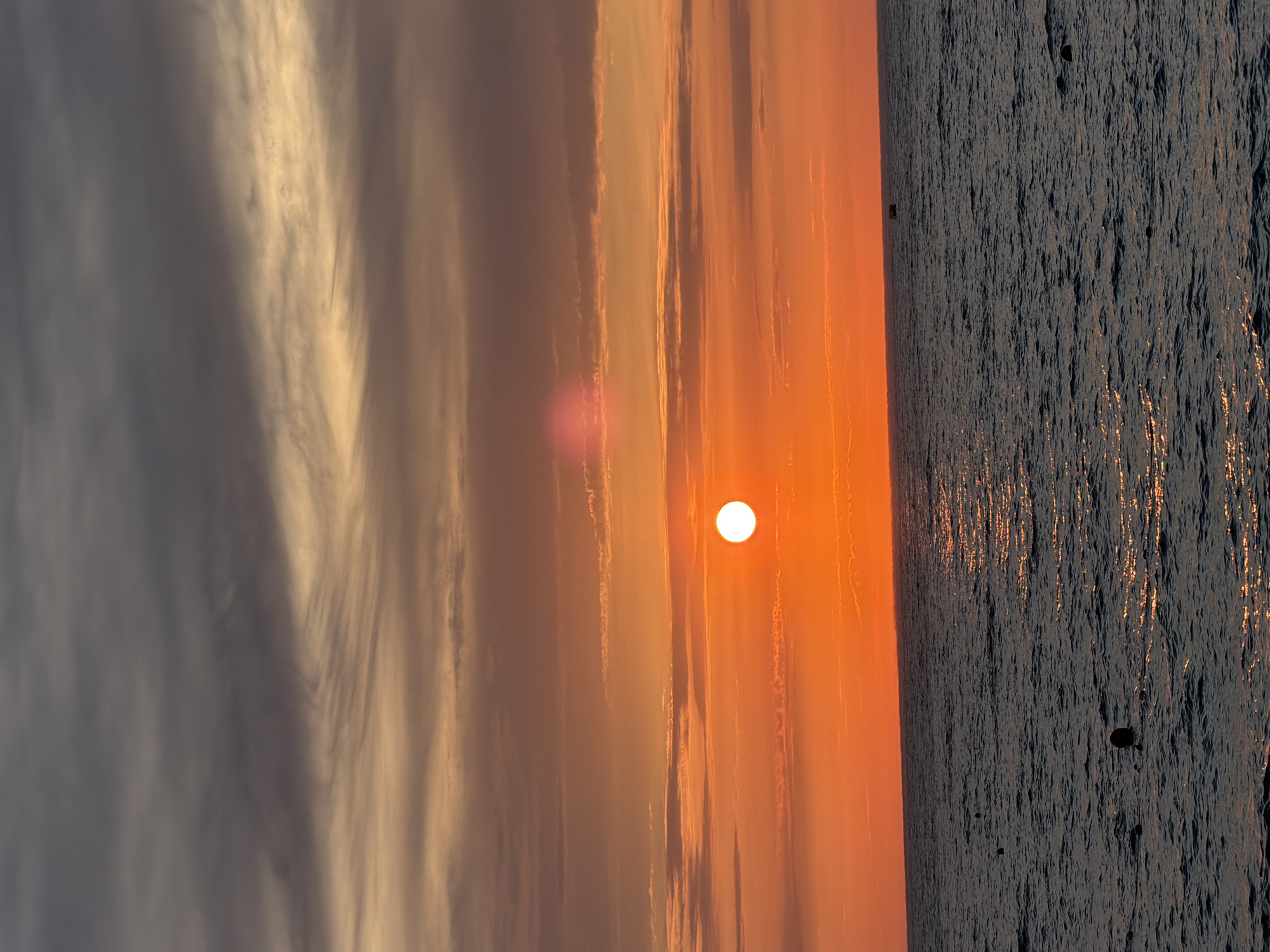 Sunset on the Russian coast, people hanging out nearby