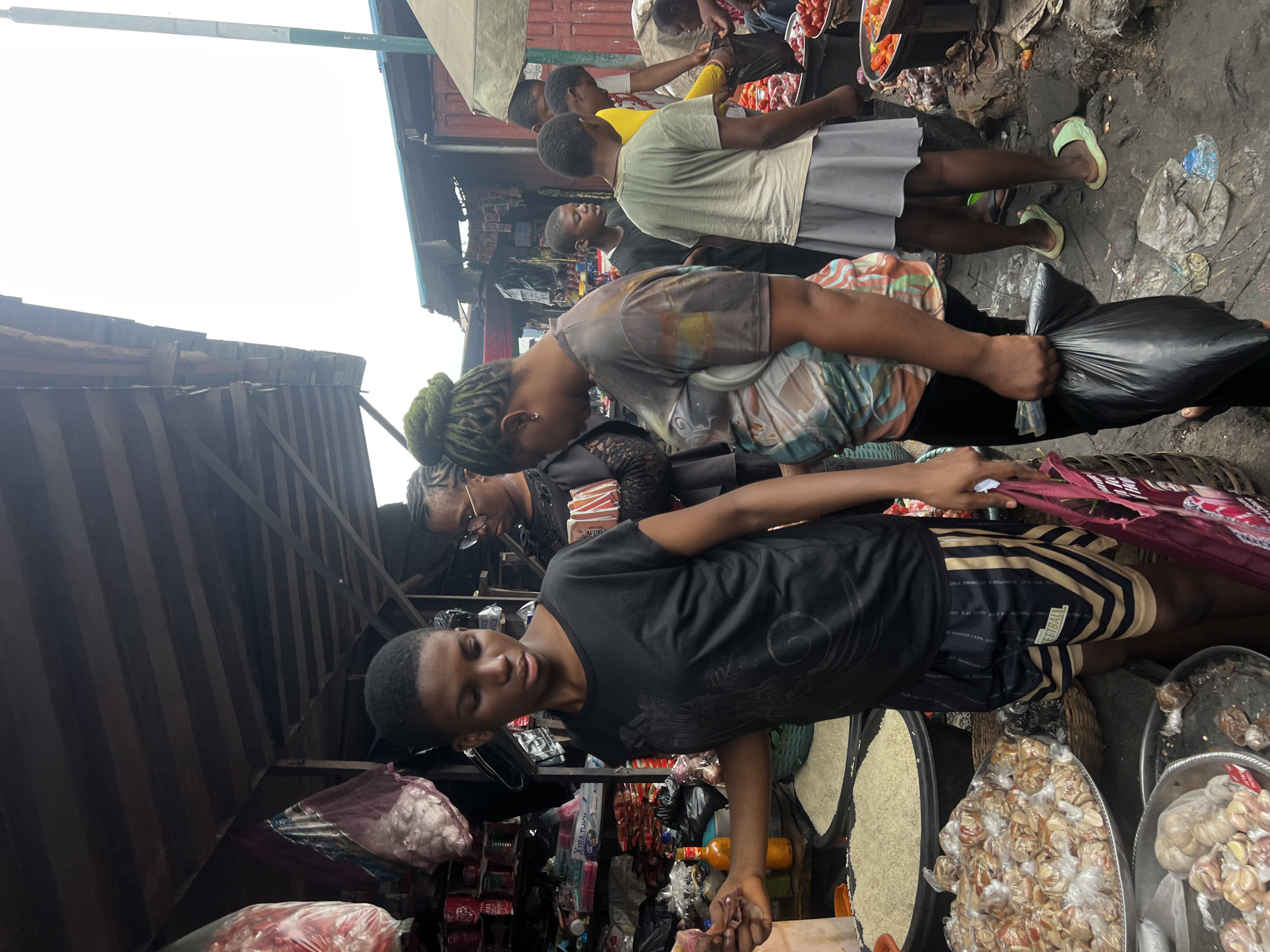 Nkpor market in full morning swing — produce, fabric, food stalls