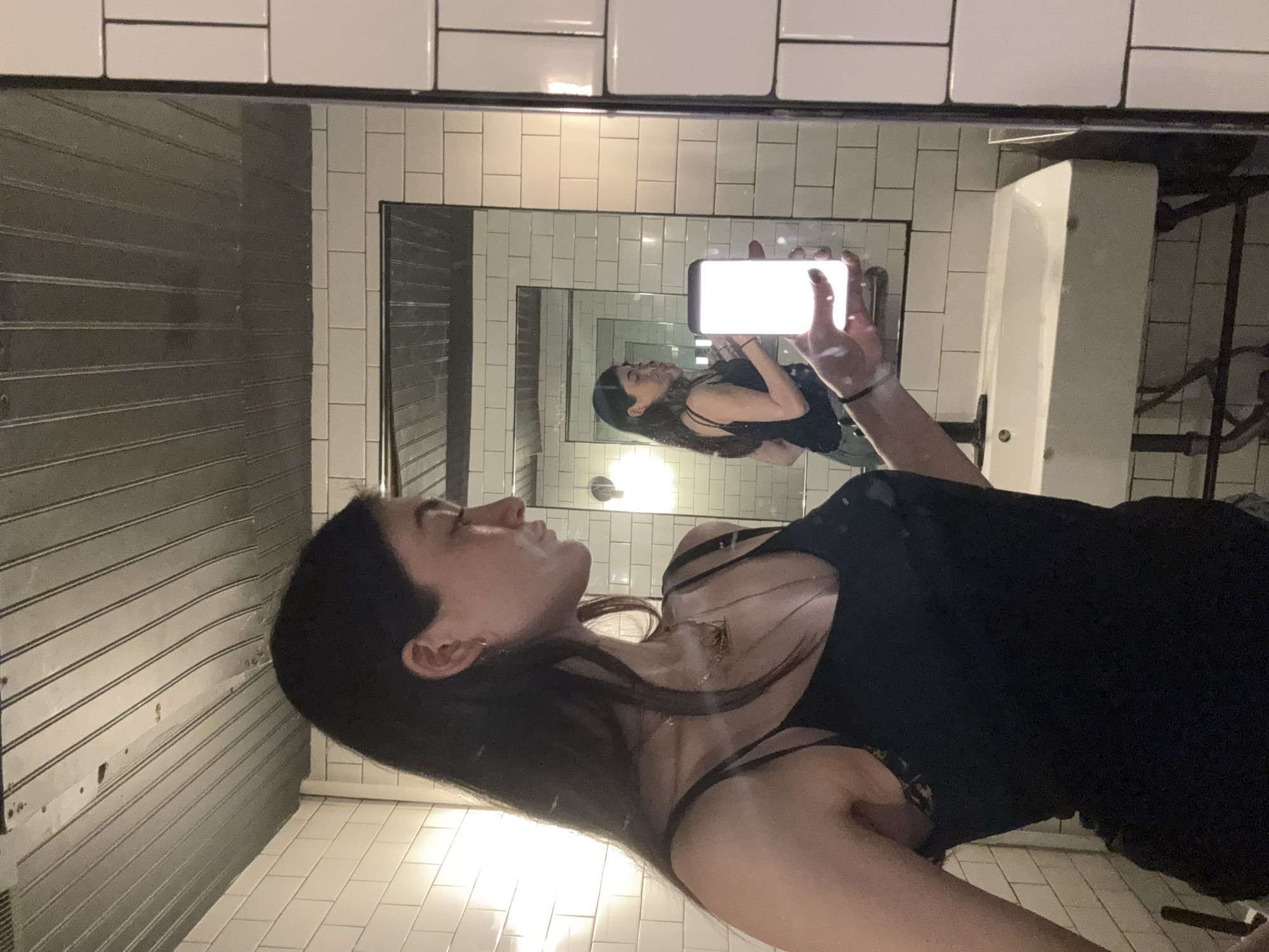 Woman takes bathroom selfie in NYC early morning
