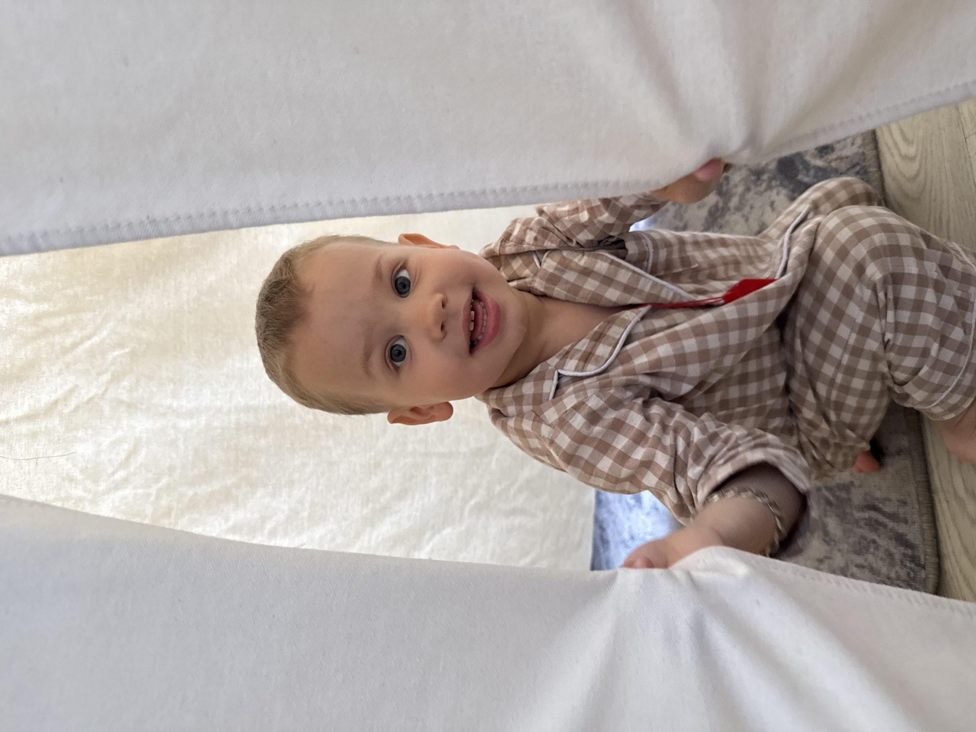 Toddler in pajamas playing indoors in Rusanovo, Russia