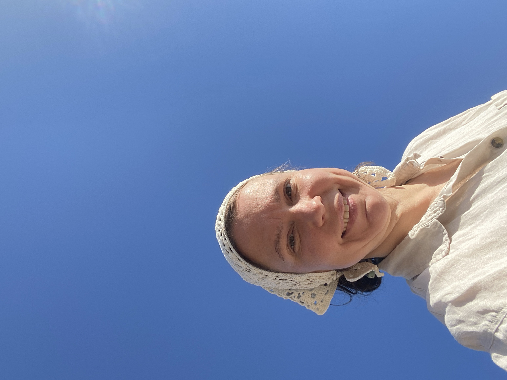 Woman enjoys sunny morning at Kama Reservoir beach in Russia